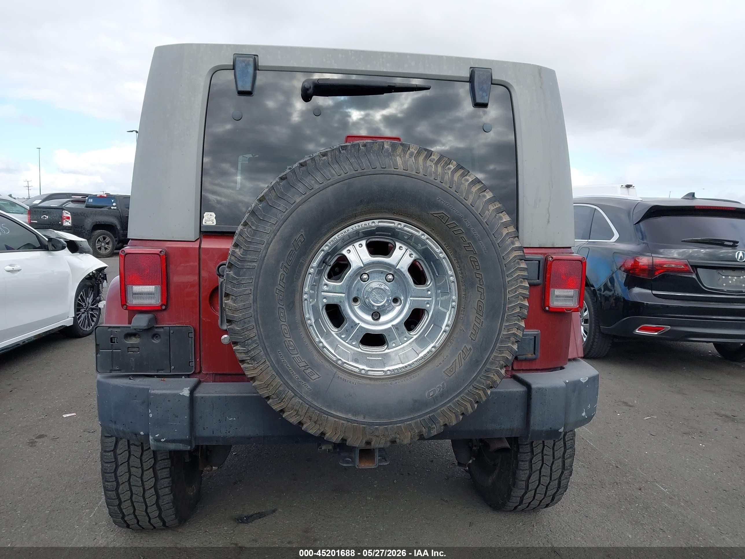 2007 Jeep Wrangler Unlimited Sahara Темно-бордовый vin: 1J8GA59117L117527
