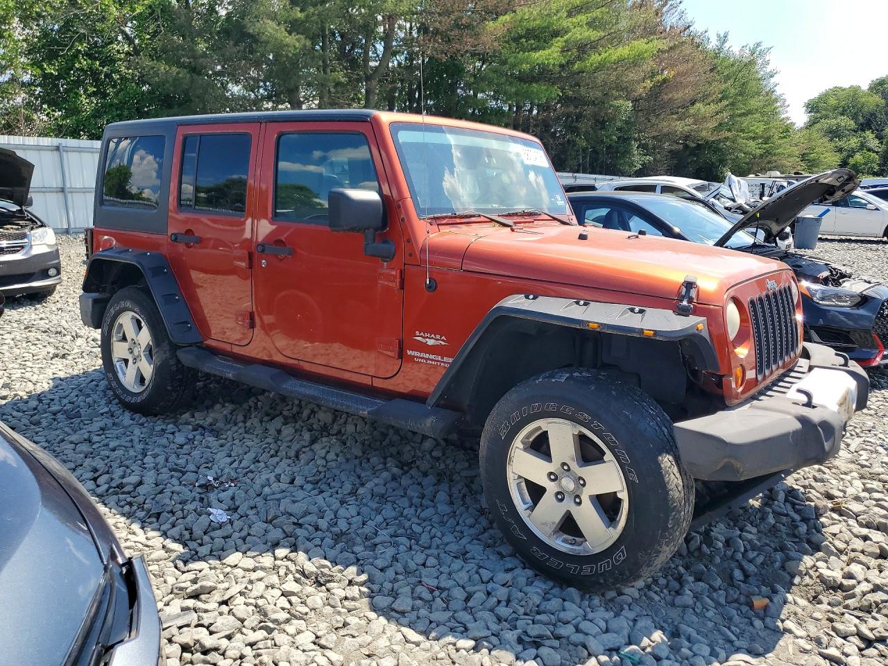 2009 Jeep Wrangler Unlimited Sahara Orange vin: 1J8GA59149L711158