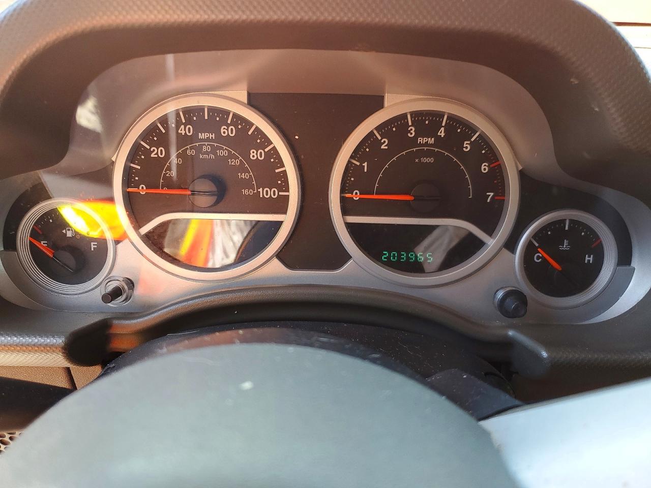 2009 Jeep Wrangler Unlimited Sahara Orange vin: 1J8GA59149L711158