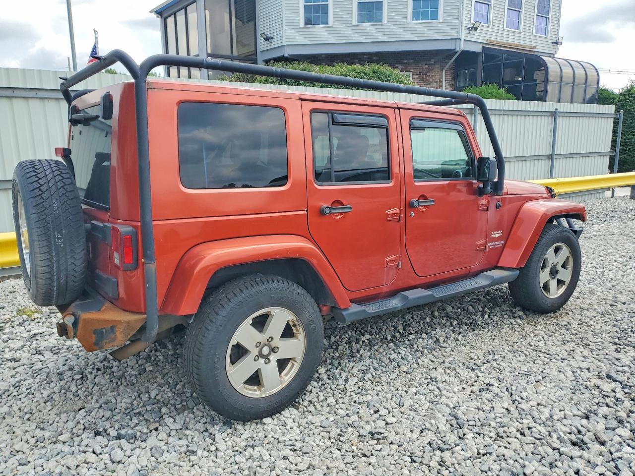 2009 Jeep Wrangler Unlimited Sahara Orange vin: 1J8GA59189L778796