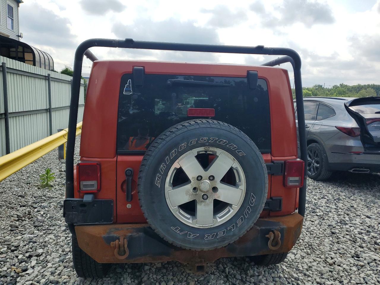 2009 Jeep Wrangler Unlimited Sahara Orange vin: 1J8GA59189L778796