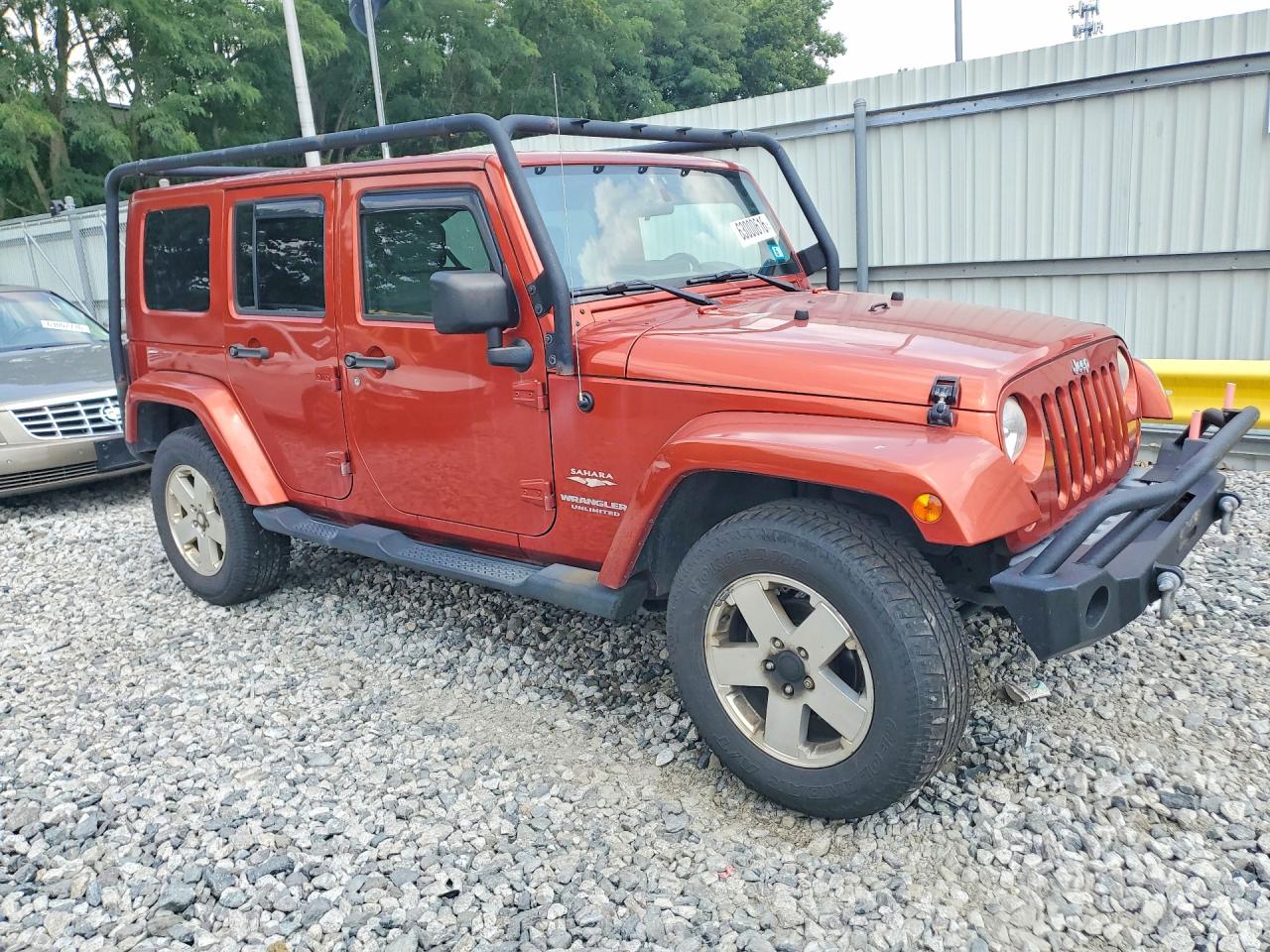 2009 Jeep Wrangler Unlimited Sahara Orange vin: 1J8GA59189L778796