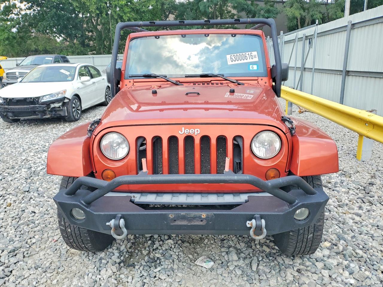 2009 Jeep Wrangler Unlimited Sahara Orange vin: 1J8GA59189L778796