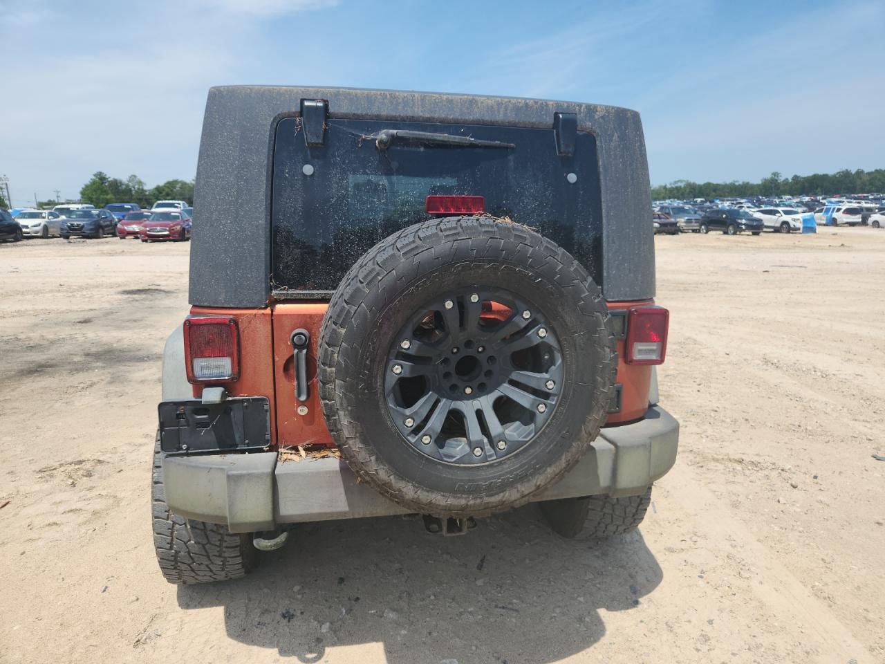 2009 Jeep Wrangler Unlimited Rubicon Orange vin: 1J8GA69169L707666 Damage: Spare Wheel, Aftermarket, Acceptable