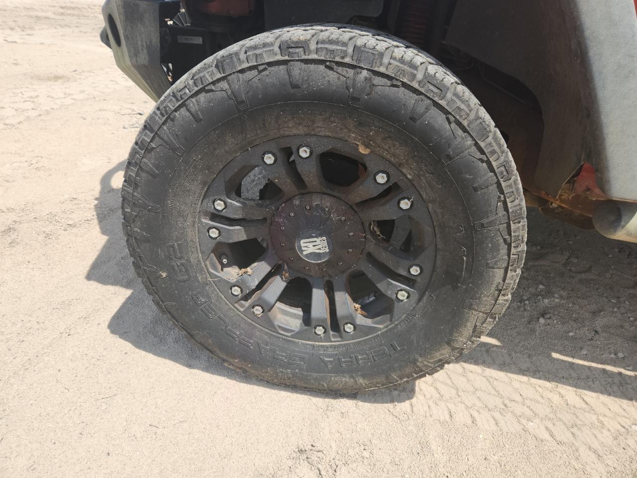 2009 Jeep Wrangler Unlimited Rubicon Orange vin: 1J8GA69169L707666 Damage: Left Front Wheel, Aftermarket, Acceptable