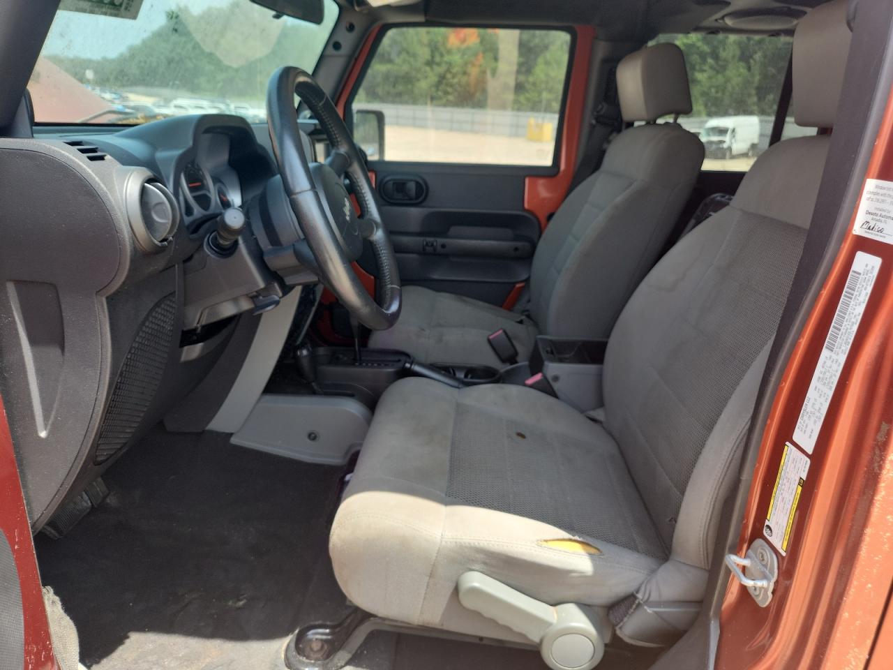 2009 Jeep Wrangler Unlimited Rubicon Orange vin: 1J8GA69169L707666 Damage: Left Front Seat Cushion, Torn, 4 To 5 Inches