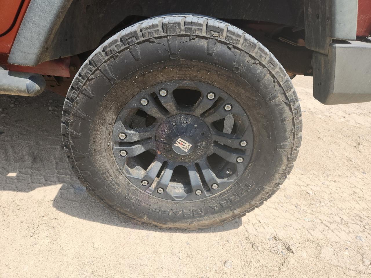 2009 Jeep Wrangler Unlimited Rubicon Orange vin: 1J8GA69169L707666 Damage: Left Rear Wheel, Aftermarket, Acceptable