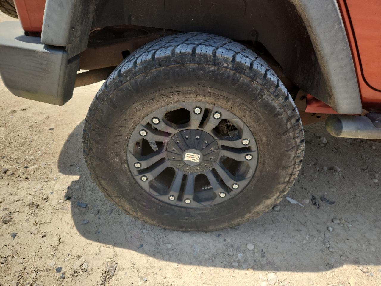 2009 Jeep Wrangler Unlimited Rubicon Orange vin: 1J8GA69169L707666 Damage: Right Rear Wheel, Aftermarket, Acceptable