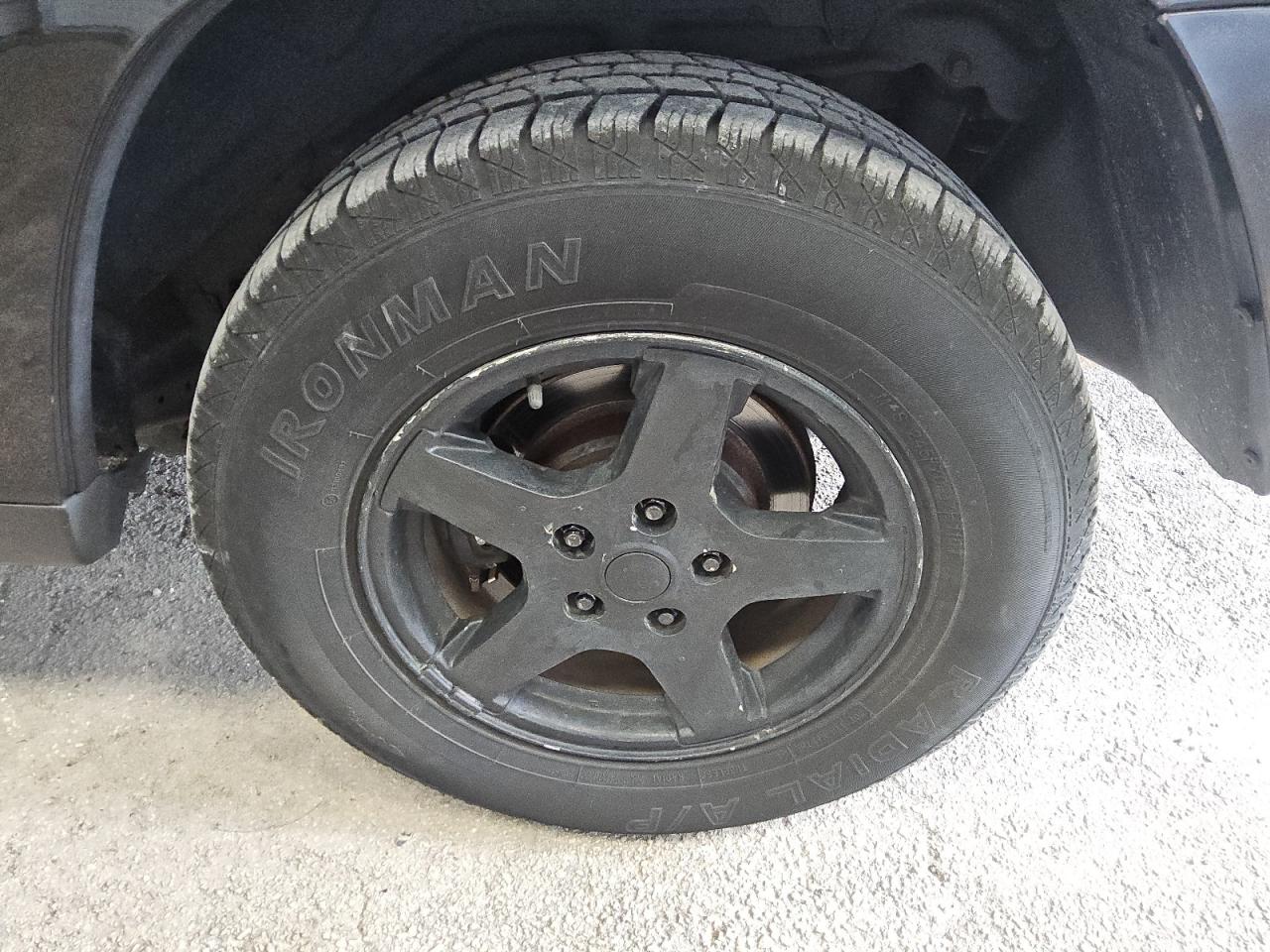 2007 Jeep Grand Cherokee Laredo Black vin: 1J8GR48K57C619616 Damage: Left Rear Wheel, Curb Rash, > 12 Inches