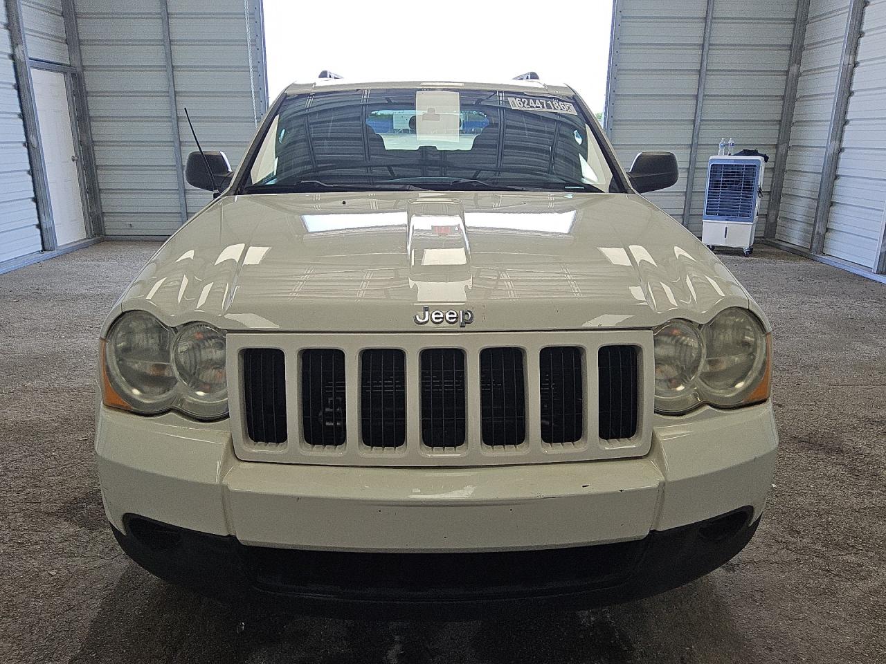 2009 Jeep Grand Cherokee Laredo White vin: 1J8GS48K59C538302 Damage: Left Head Lamp, Faded, Repair Required