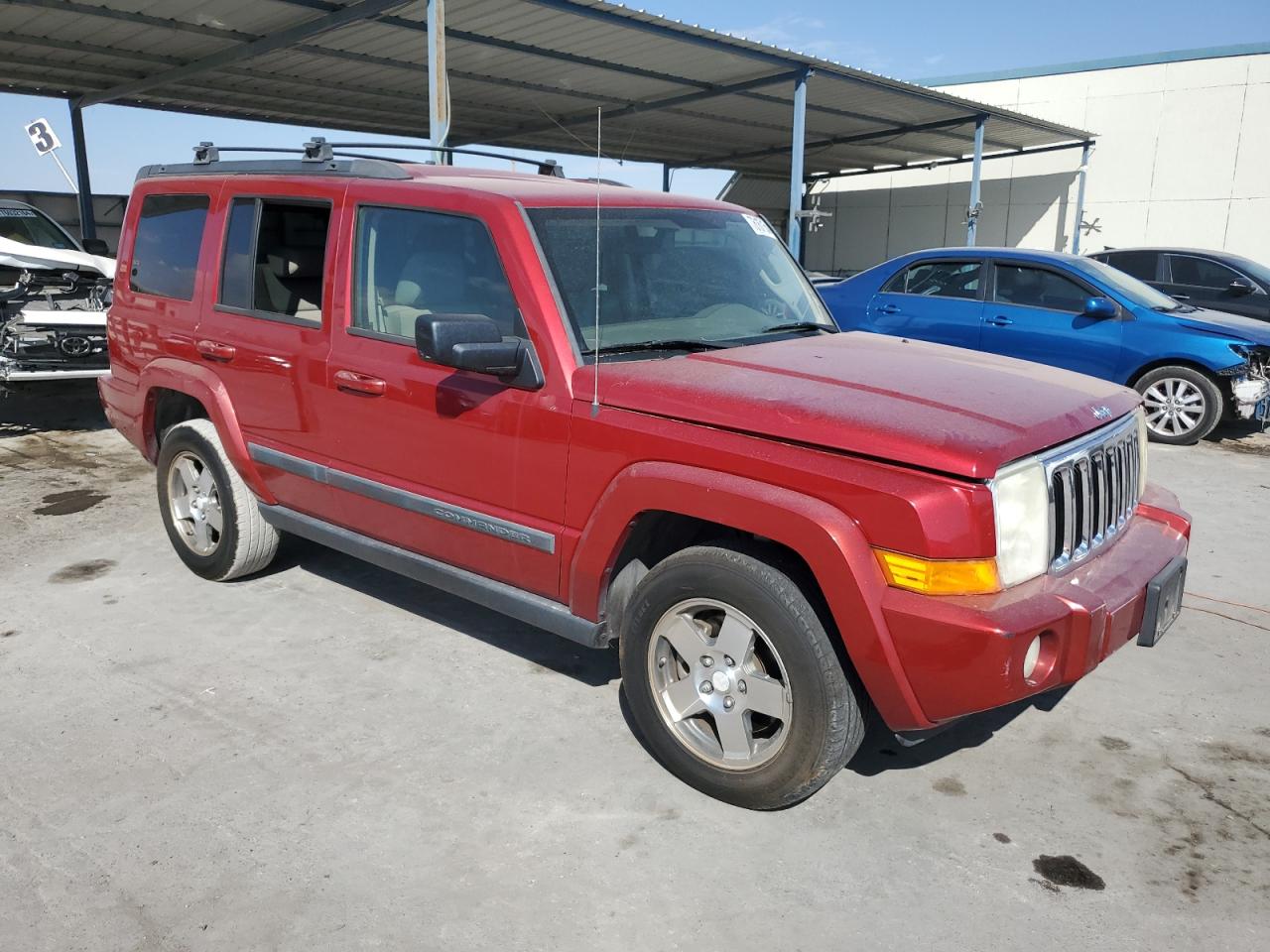 2009 Jeep Commander Red vin: 1J8HH48K99C555350