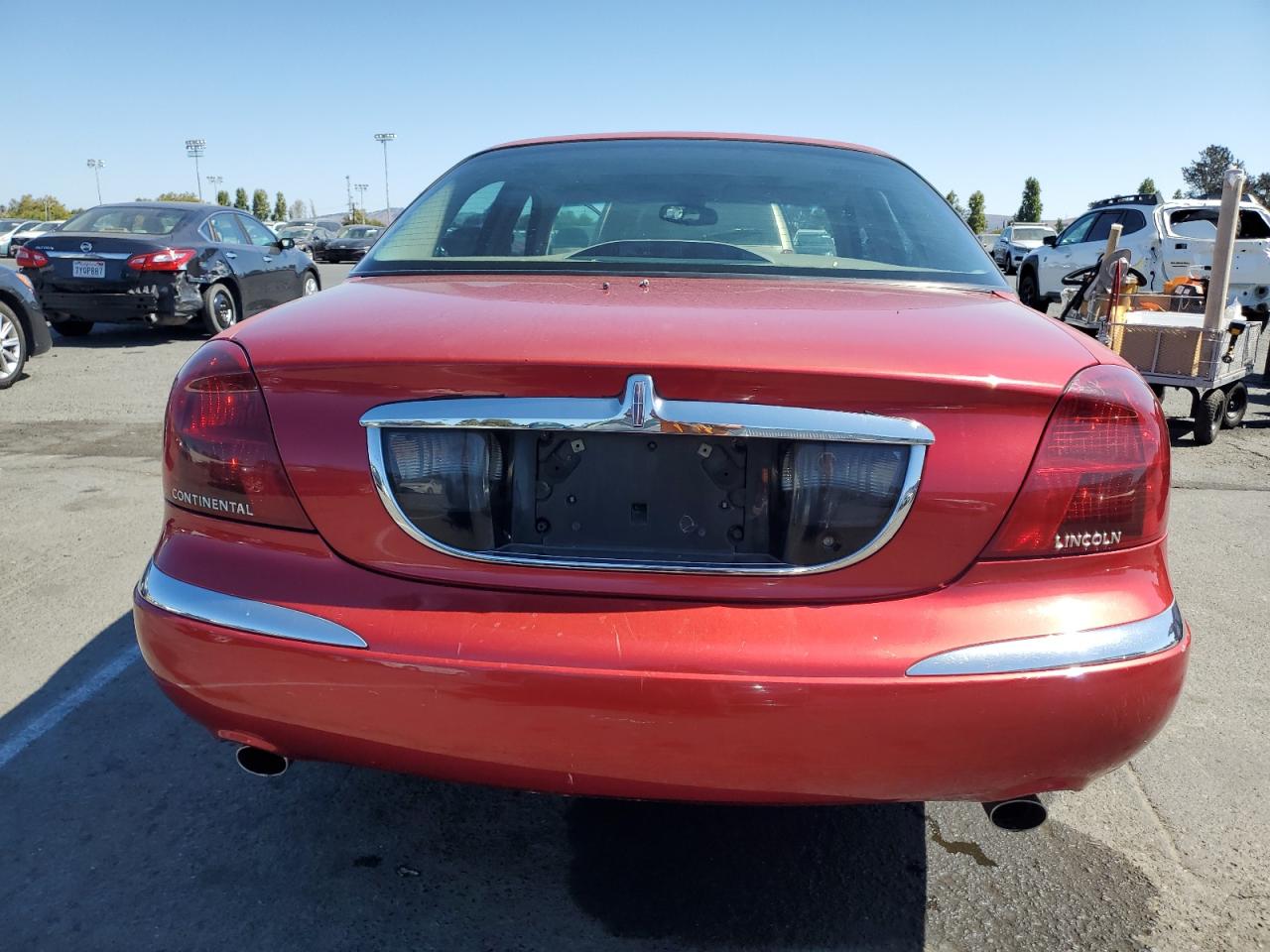 1998 Lincoln Continental Red vin: 1LNFM97V0WY605789