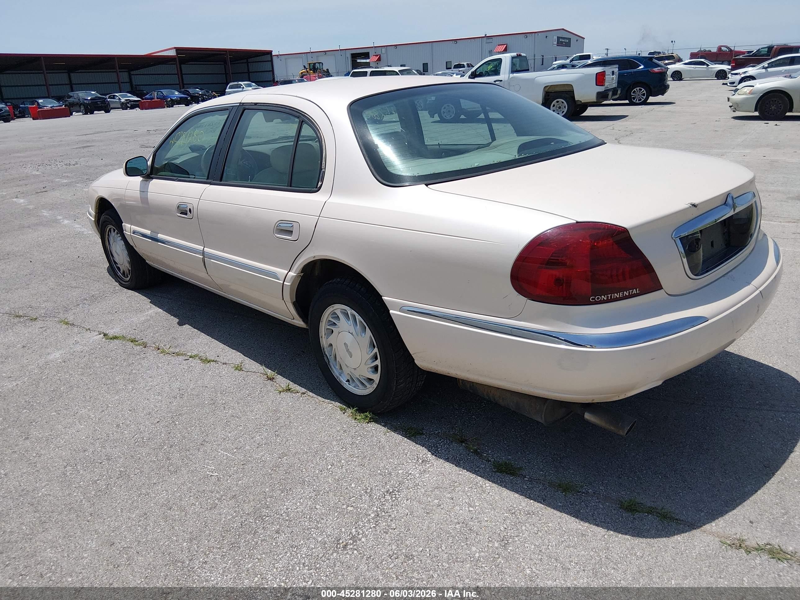 1998 Lincoln Continental   Tan vin: 1LNFM97V7WY634111