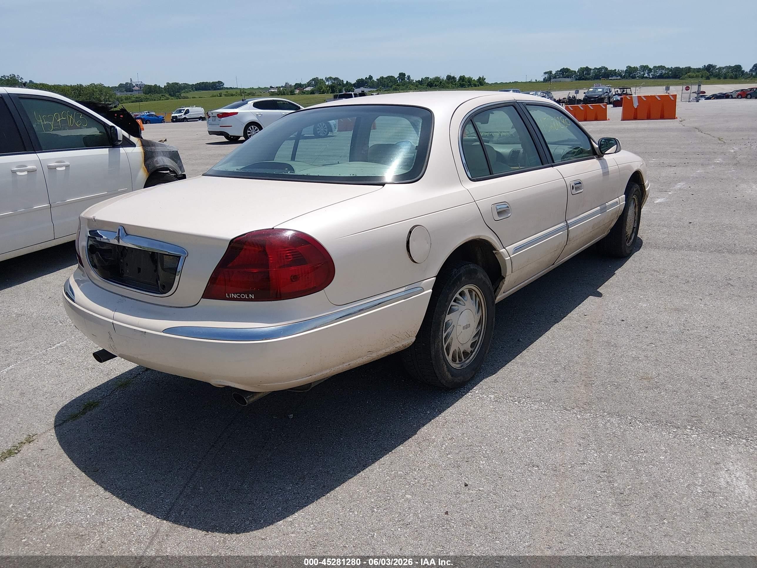 1998 Lincoln Continental   Tan vin: 1LNFM97V7WY634111