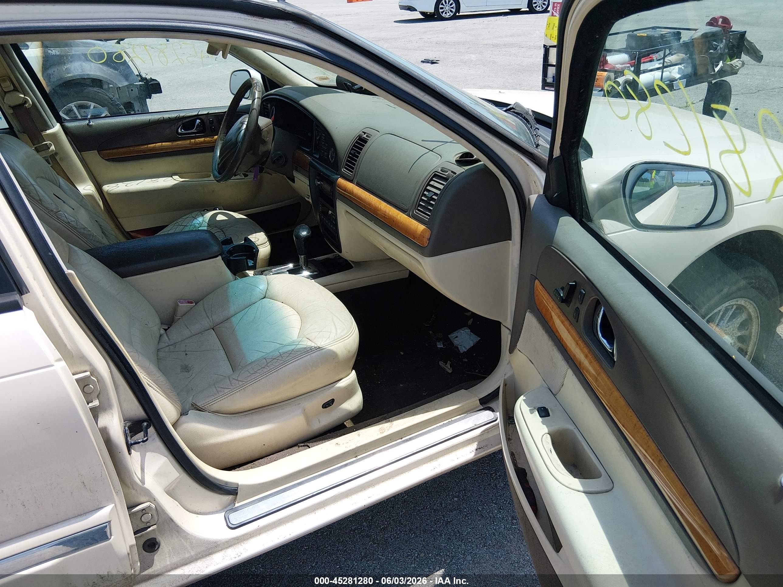 1998 Lincoln Continental   Tan vin: 1LNFM97V7WY634111