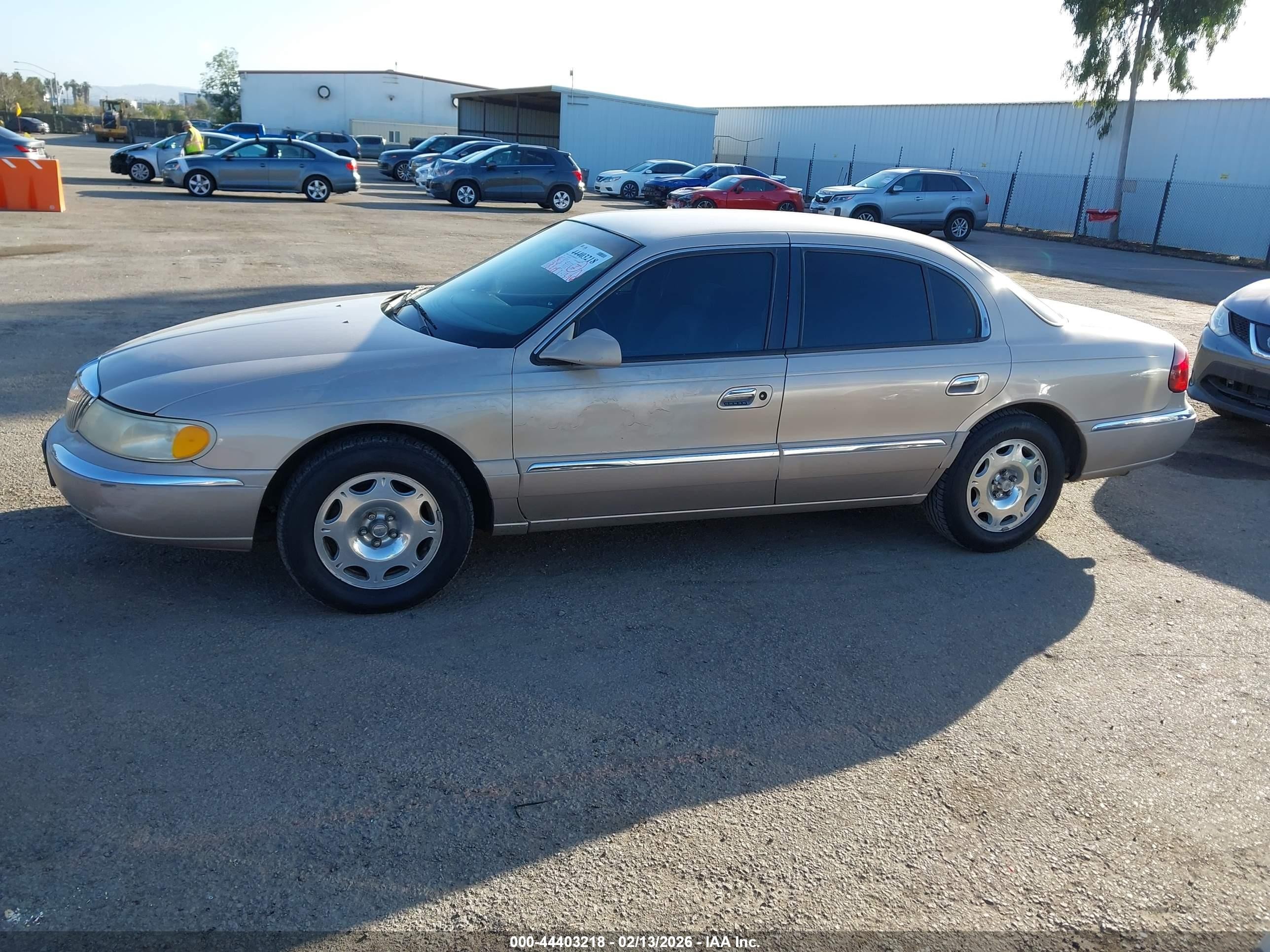 1998 Lincoln Continental   Champagne vin: 1LNFM97V7WY658487