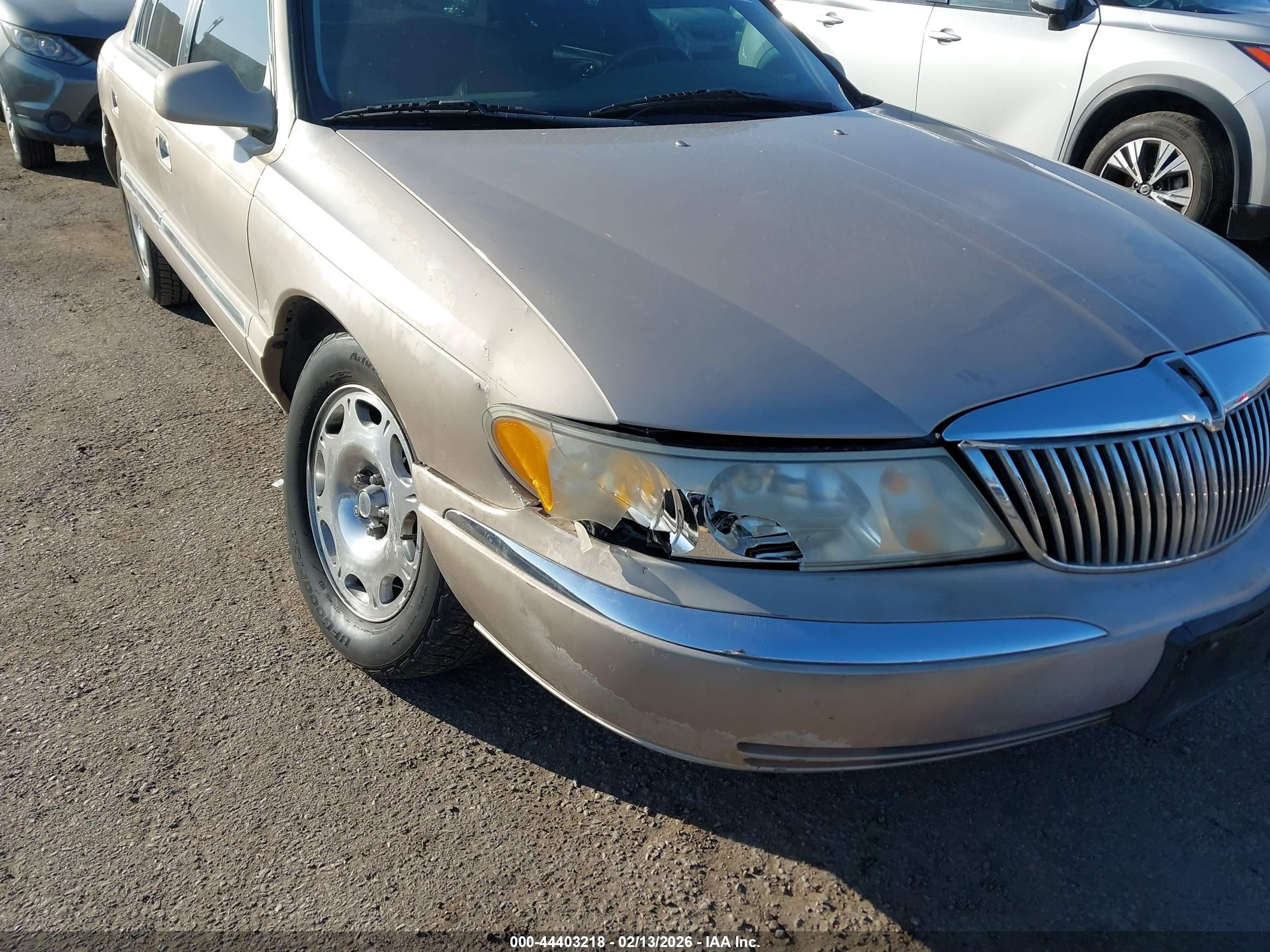 1998 Lincoln Continental   Champagne vin: 1LNFM97V7WY658487
