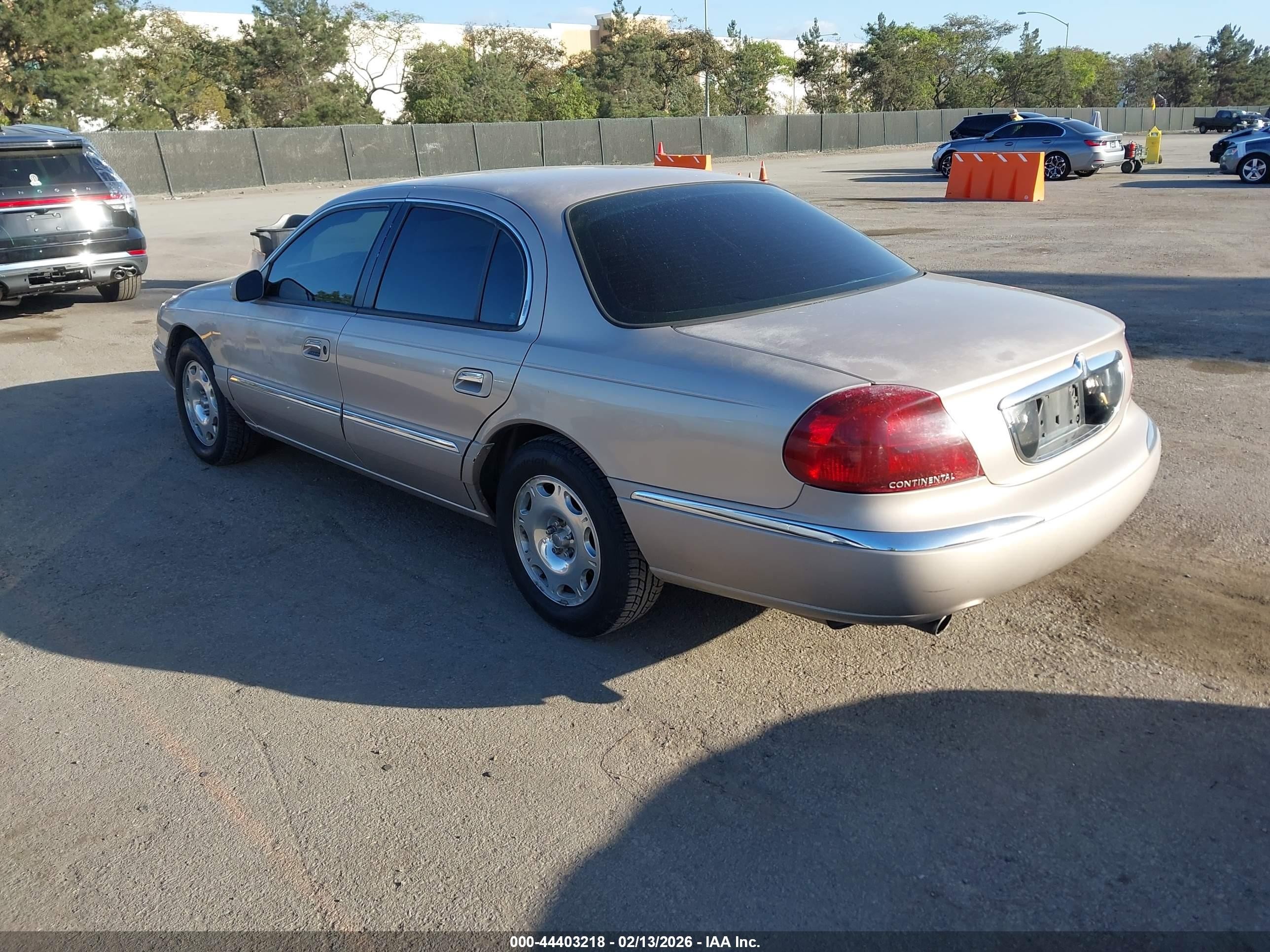 1998 Lincoln Continental   Champagne vin: 1LNFM97V7WY658487