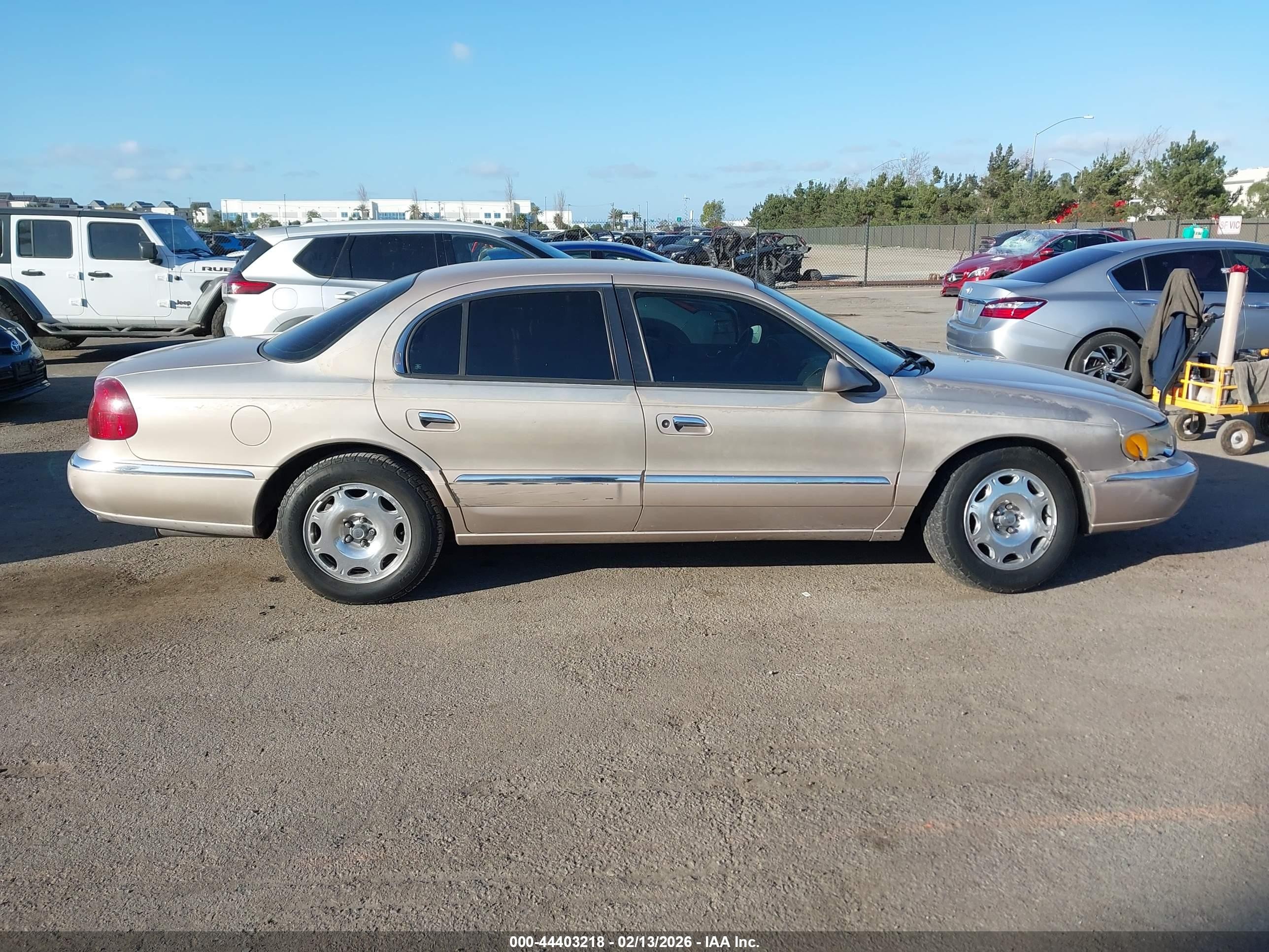 1998 Lincoln Continental   Champagne vin: 1LNFM97V7WY658487