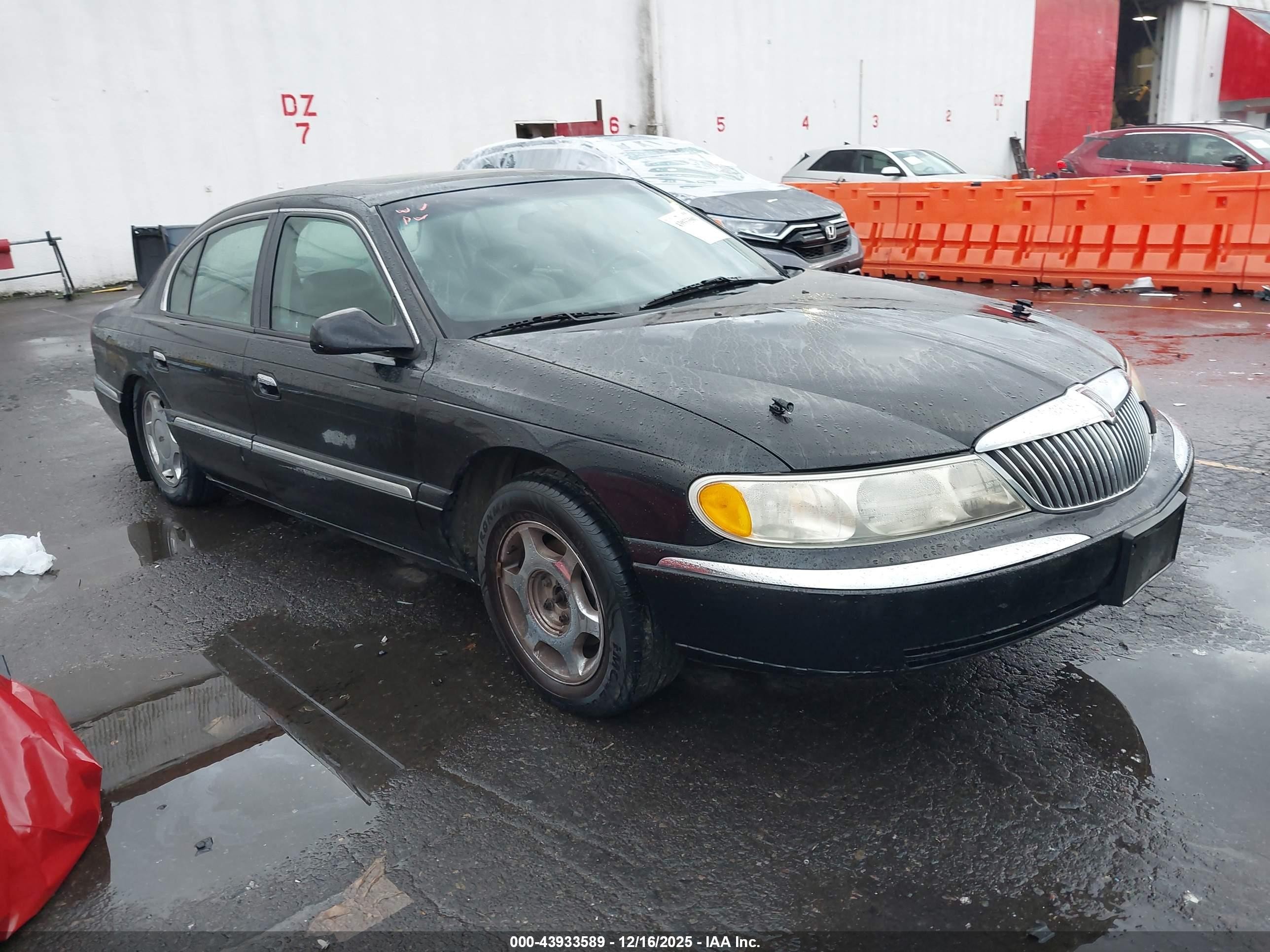 1998 Lincoln Continental   Black vin: 1LNFM97V9WY676425