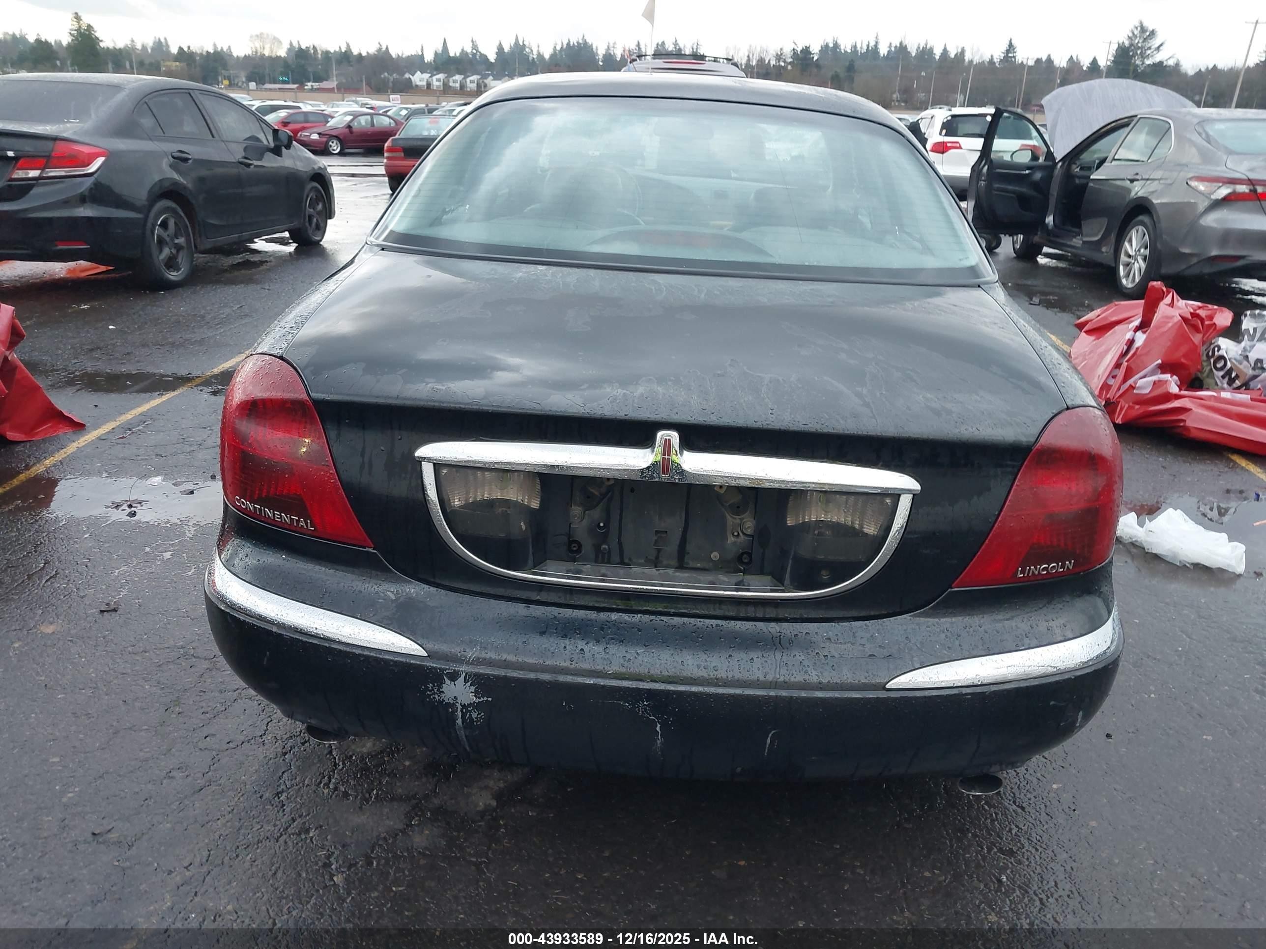 1998 Lincoln Continental   Black vin: 1LNFM97V9WY676425