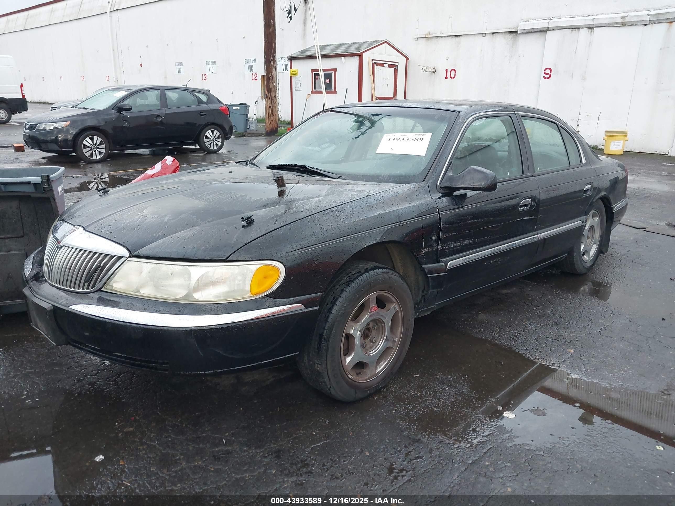 1998 Lincoln Continental   Black vin: 1LNFM97V9WY676425