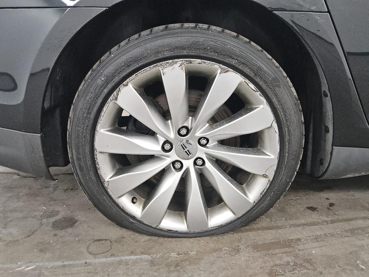2015 Lincoln Mks Black vin: 1LNHL9DK8FG605079 Damage: Right Rear Wheel, Curb Rash, > 12 Inches