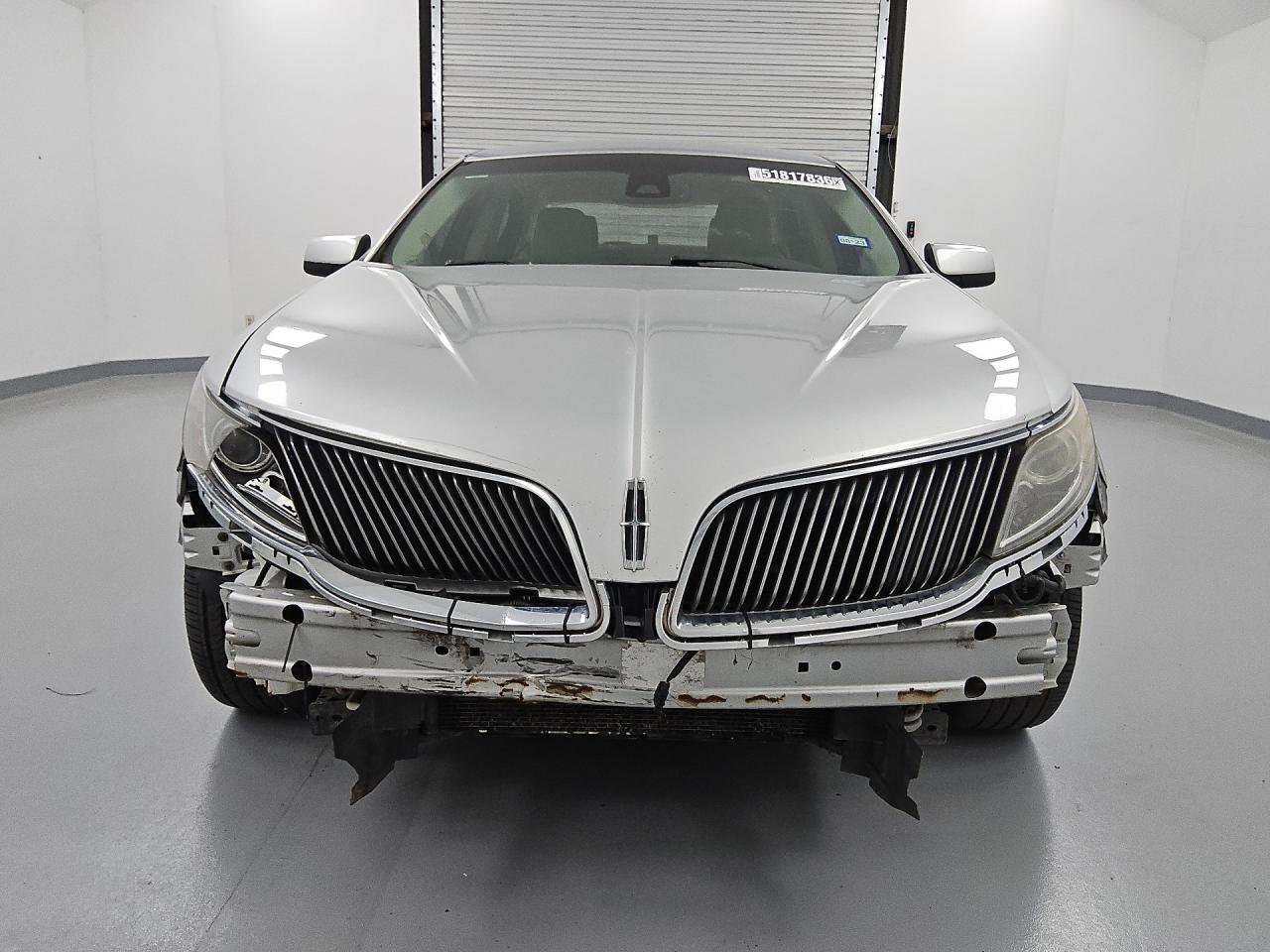 2015 Lincoln Mks Silver vin: 1LNHL9FT1FG607990 Damage: Front Bumper/Cover, Missing, Replacement Required