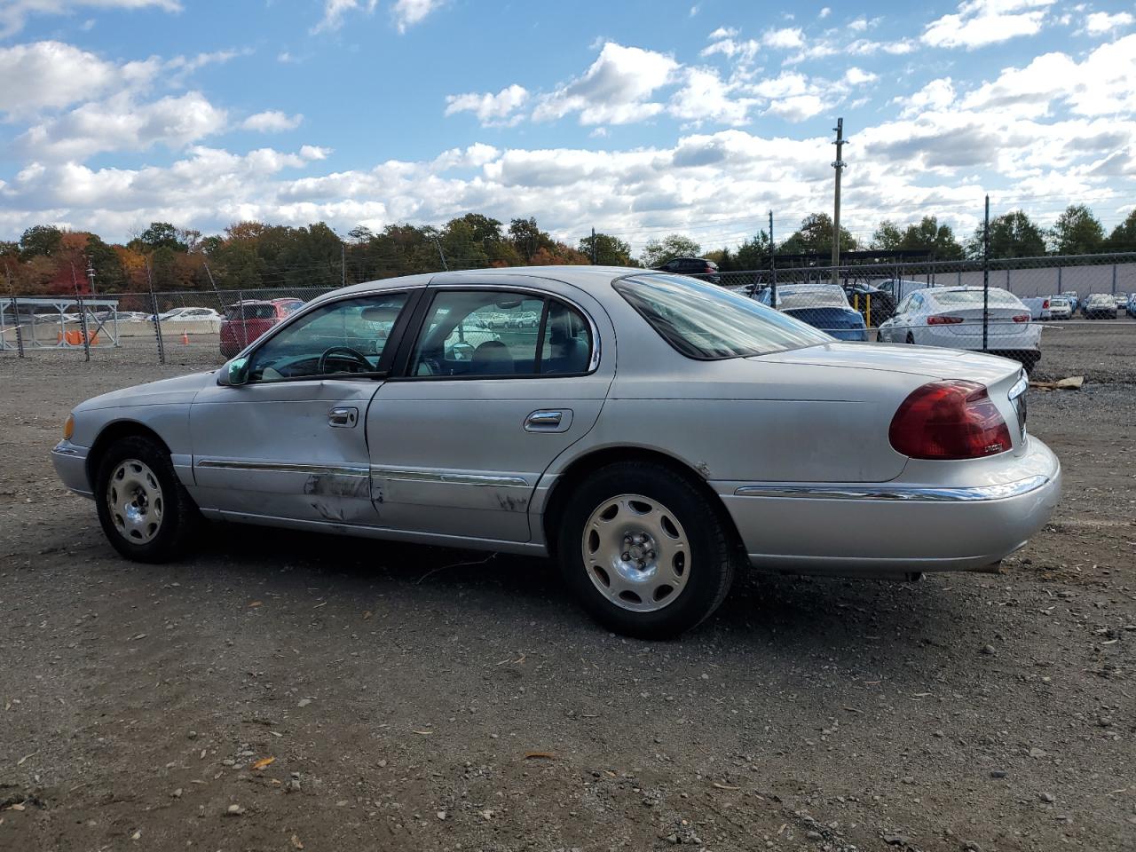 1999 Lincoln Continental Серебряный vin: 1LNHM97V0XY656705