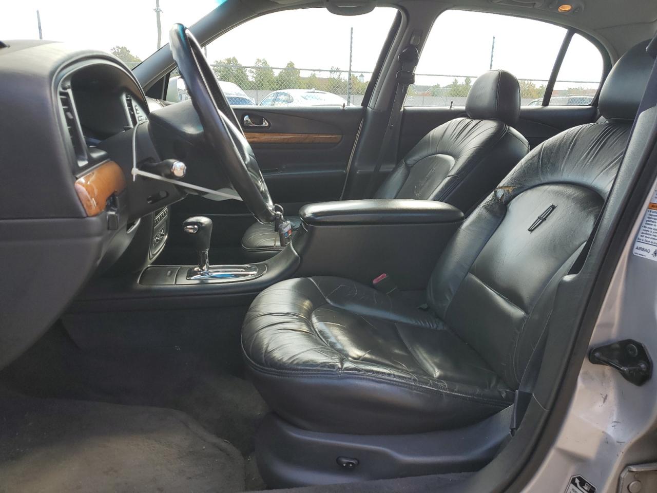 1999 Lincoln Continental Серебряный vin: 1LNHM97V0XY656705