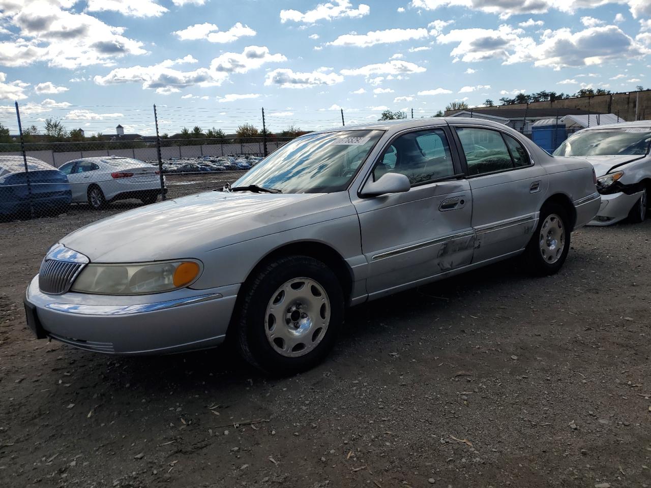 1999 Lincoln Continental Серебряный vin: 1LNHM97V0XY656705