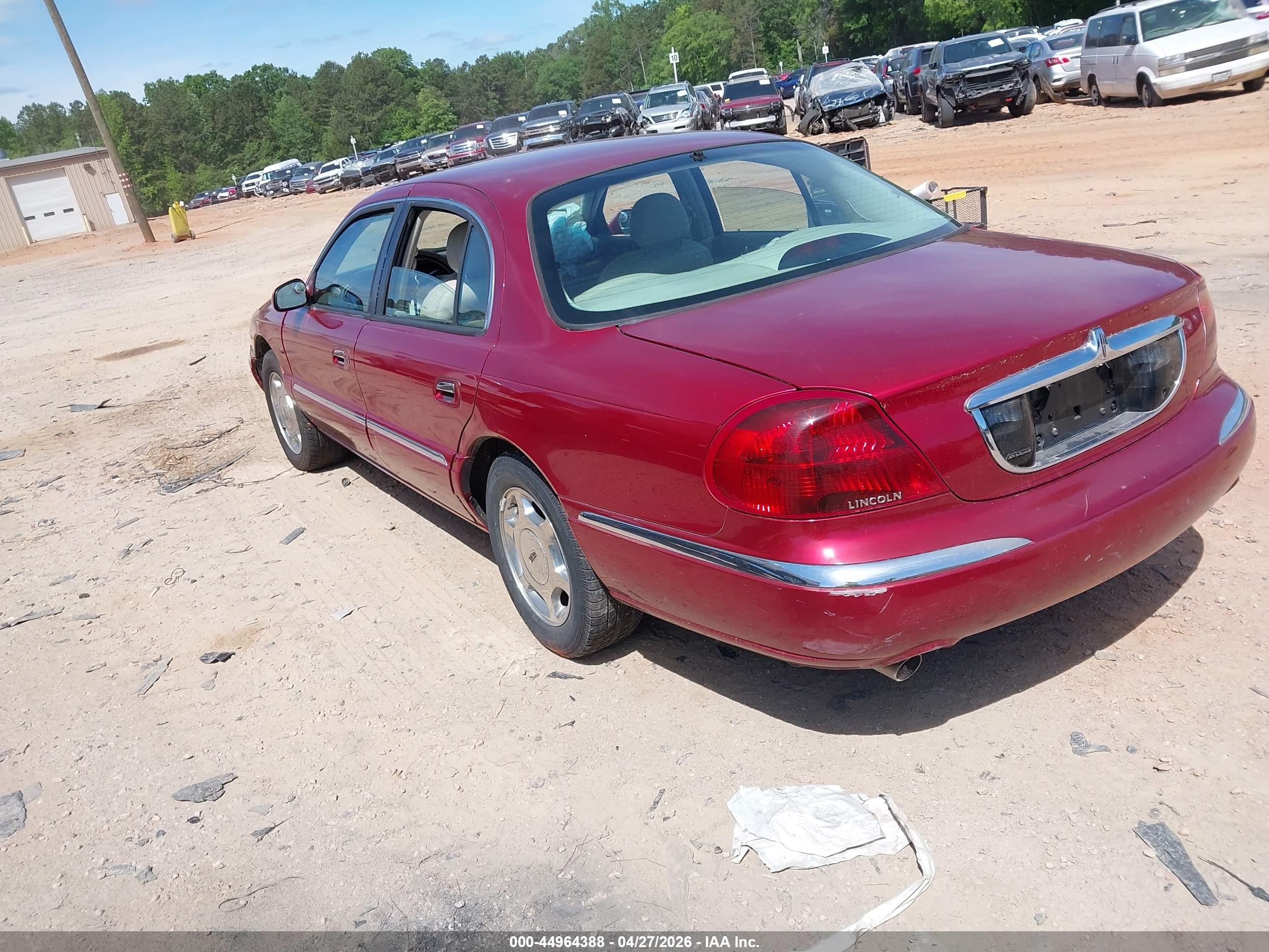1999 Lincoln Continental   Burgundy vin: 1LNHM97V0XY682270