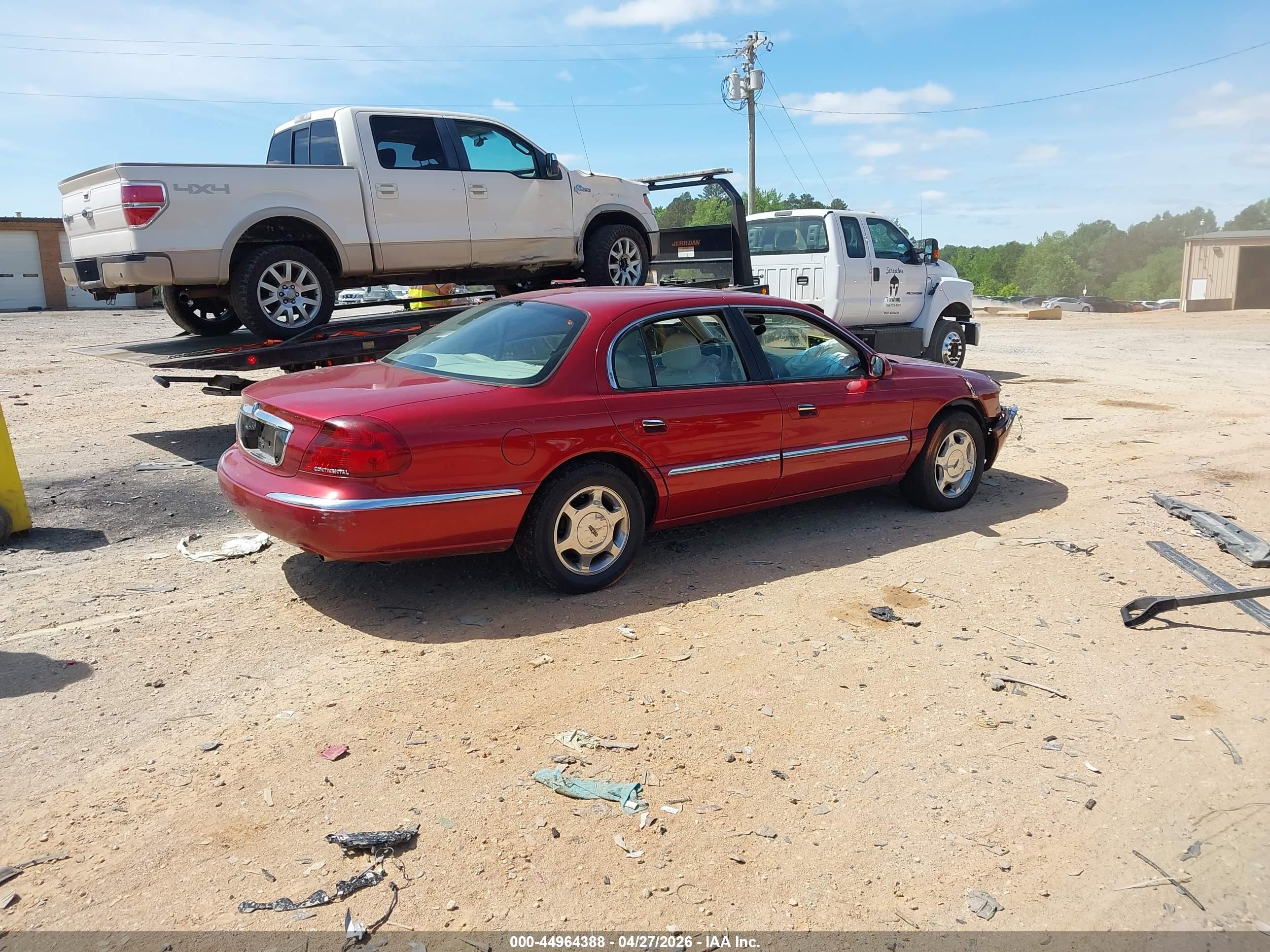 1999 Lincoln Continental   Burgundy vin: 1LNHM97V0XY682270