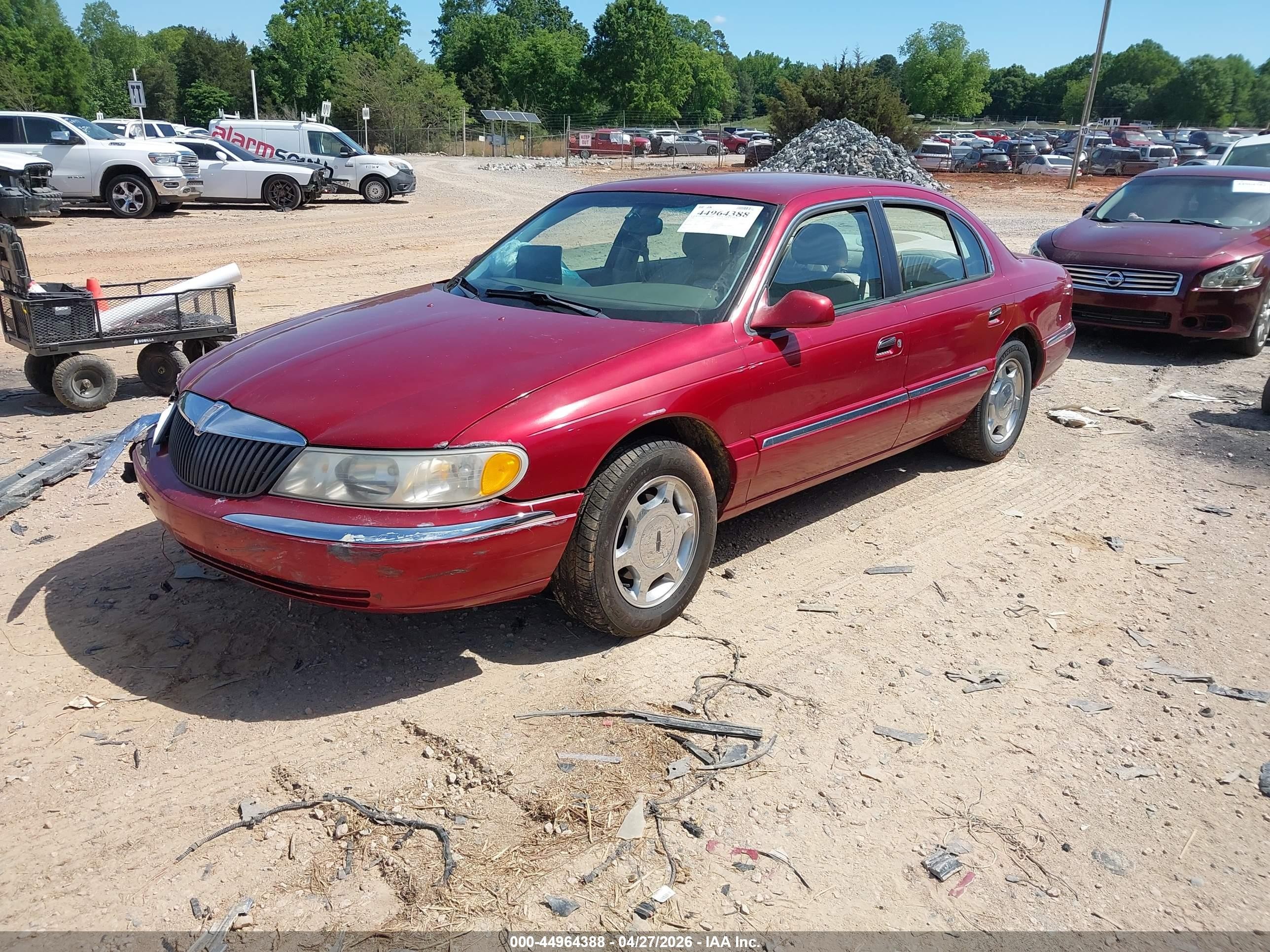1999 Lincoln Continental   Burgundy vin: 1LNHM97V0XY682270