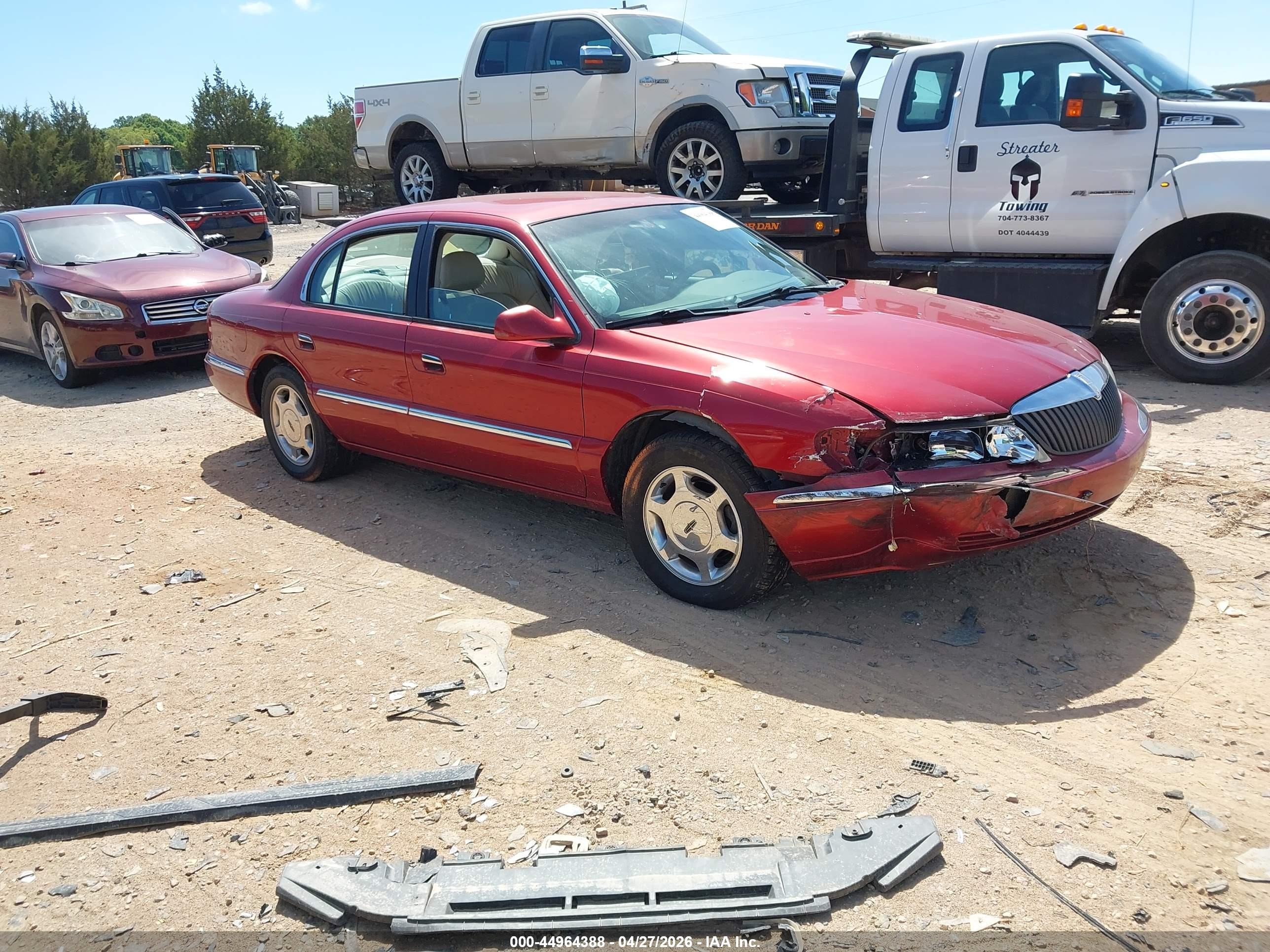 1999 Lincoln Continental   Burgundy vin: 1LNHM97V0XY682270