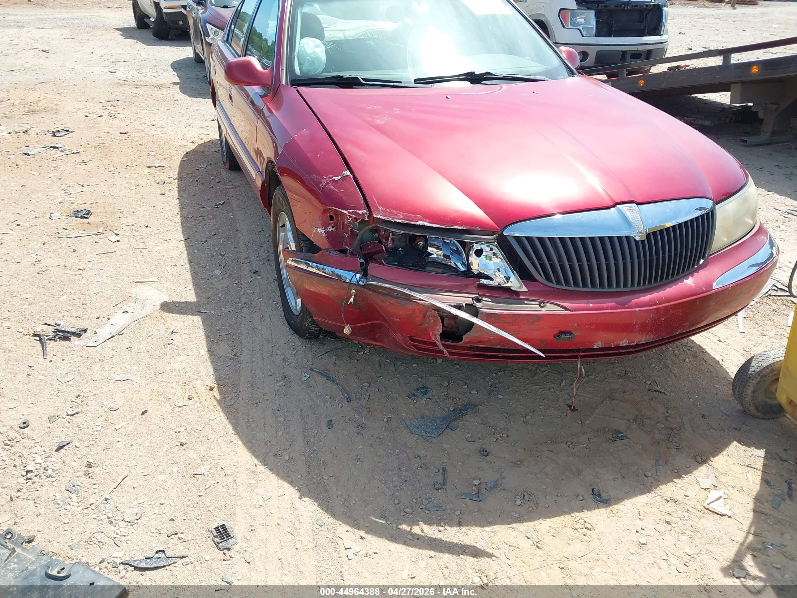 1999 Lincoln Continental   Burgundy vin: 1LNHM97V0XY682270