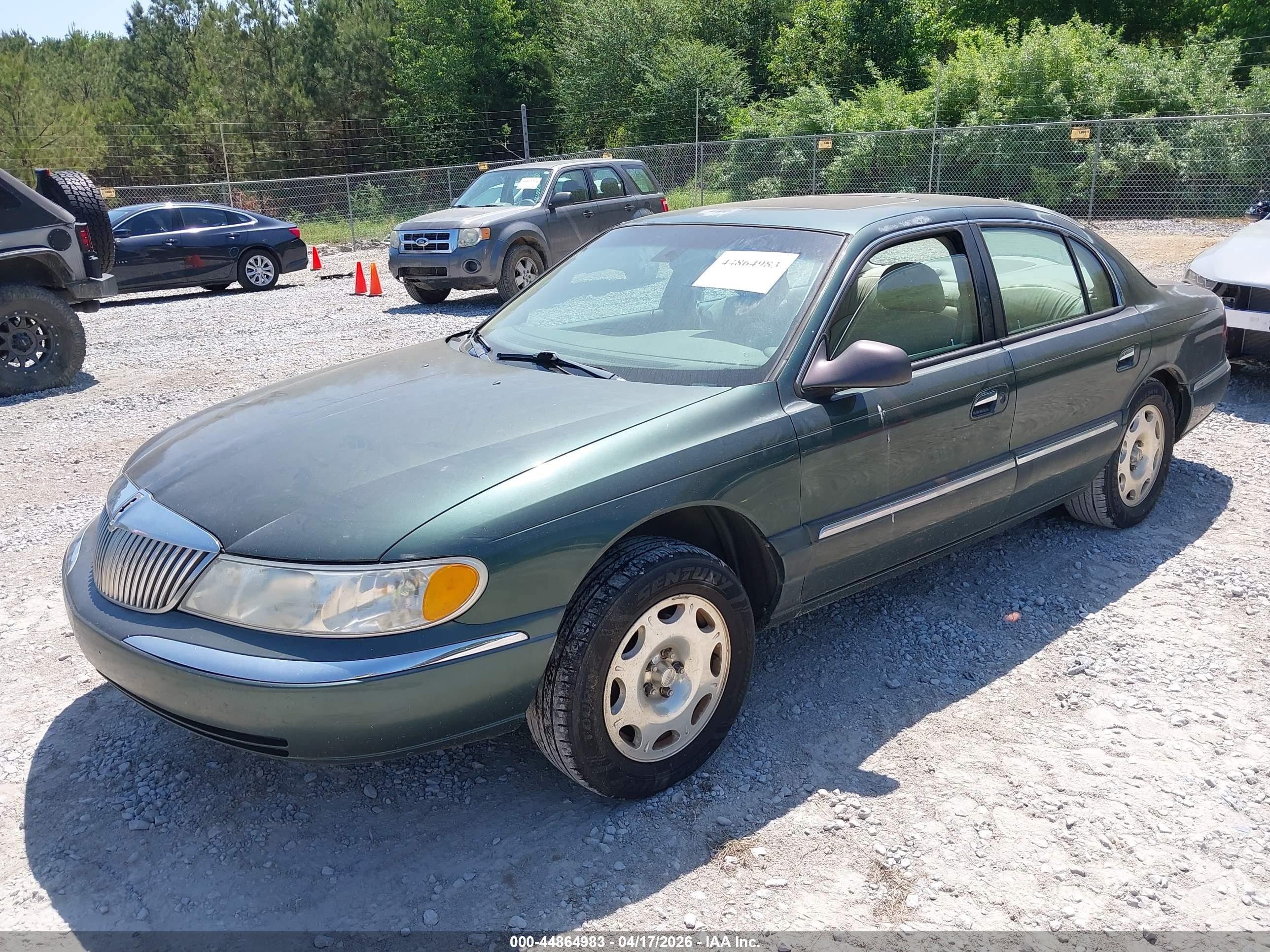 1999 Lincoln Continental   Green vin: 1LNHM97V0XY704705