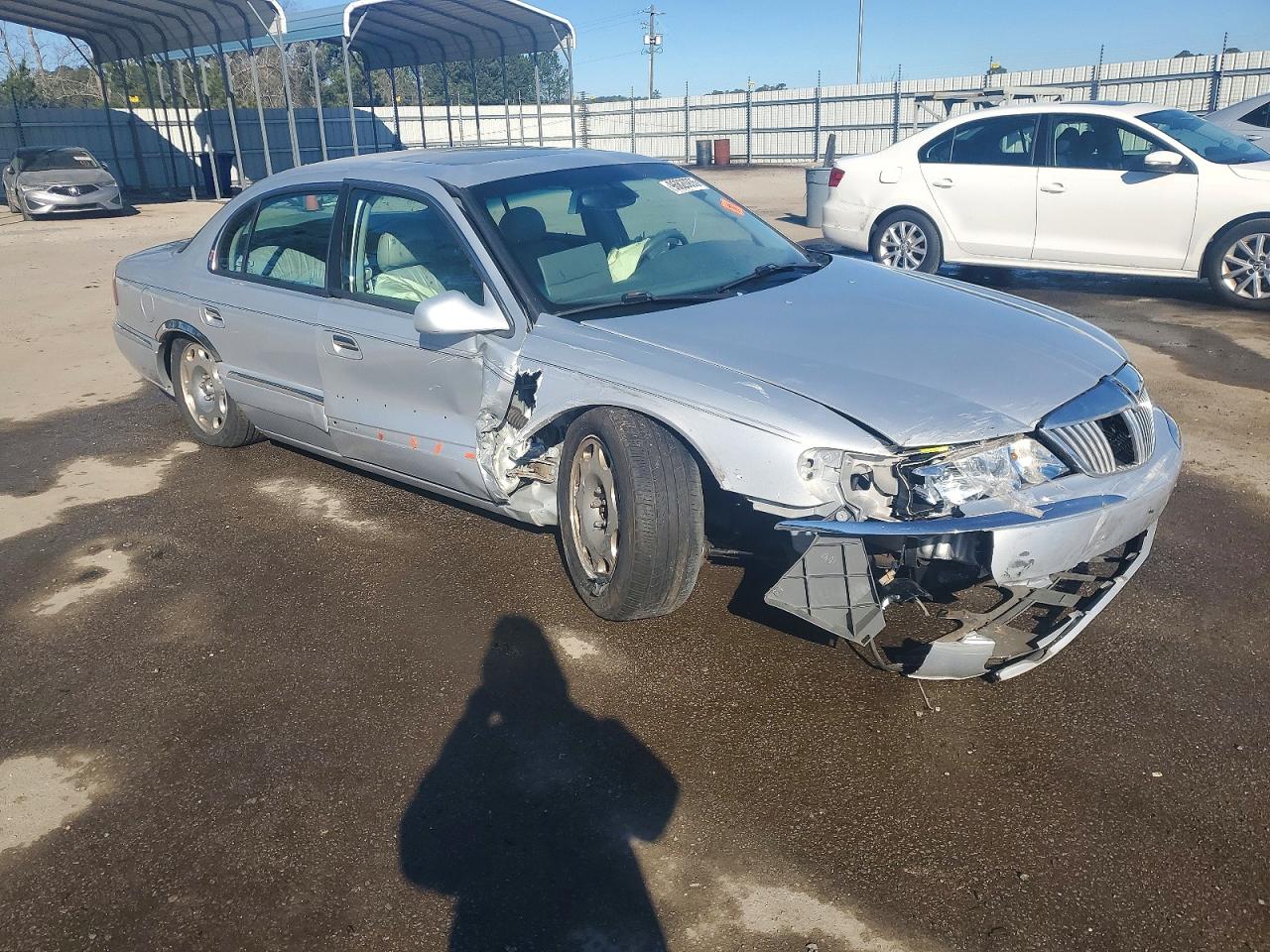 1999 Lincoln Continental Silver vin: 1LNHM97V0XY721200