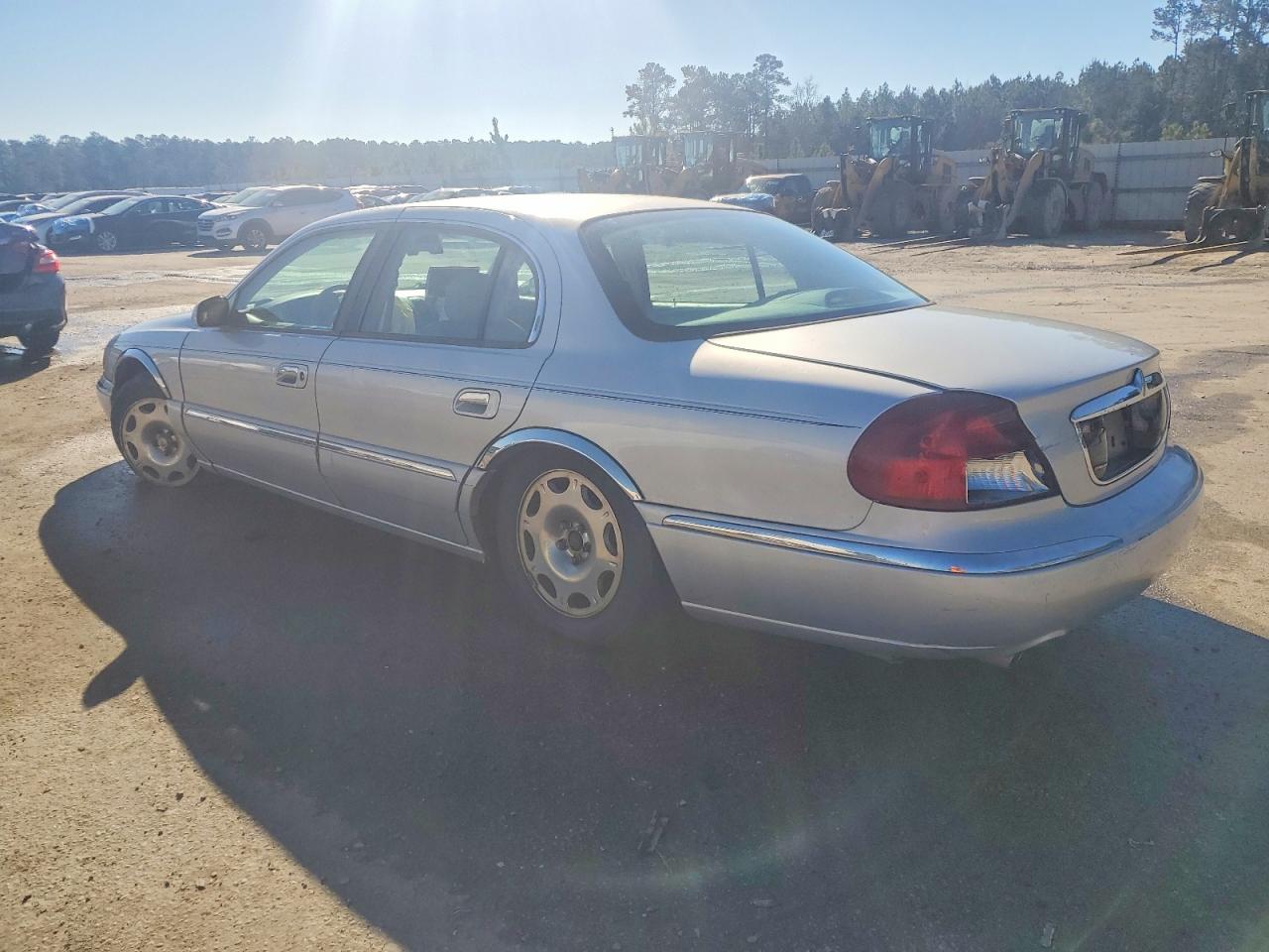 1999 Lincoln Continental Silver vin: 1LNHM97V0XY721200
