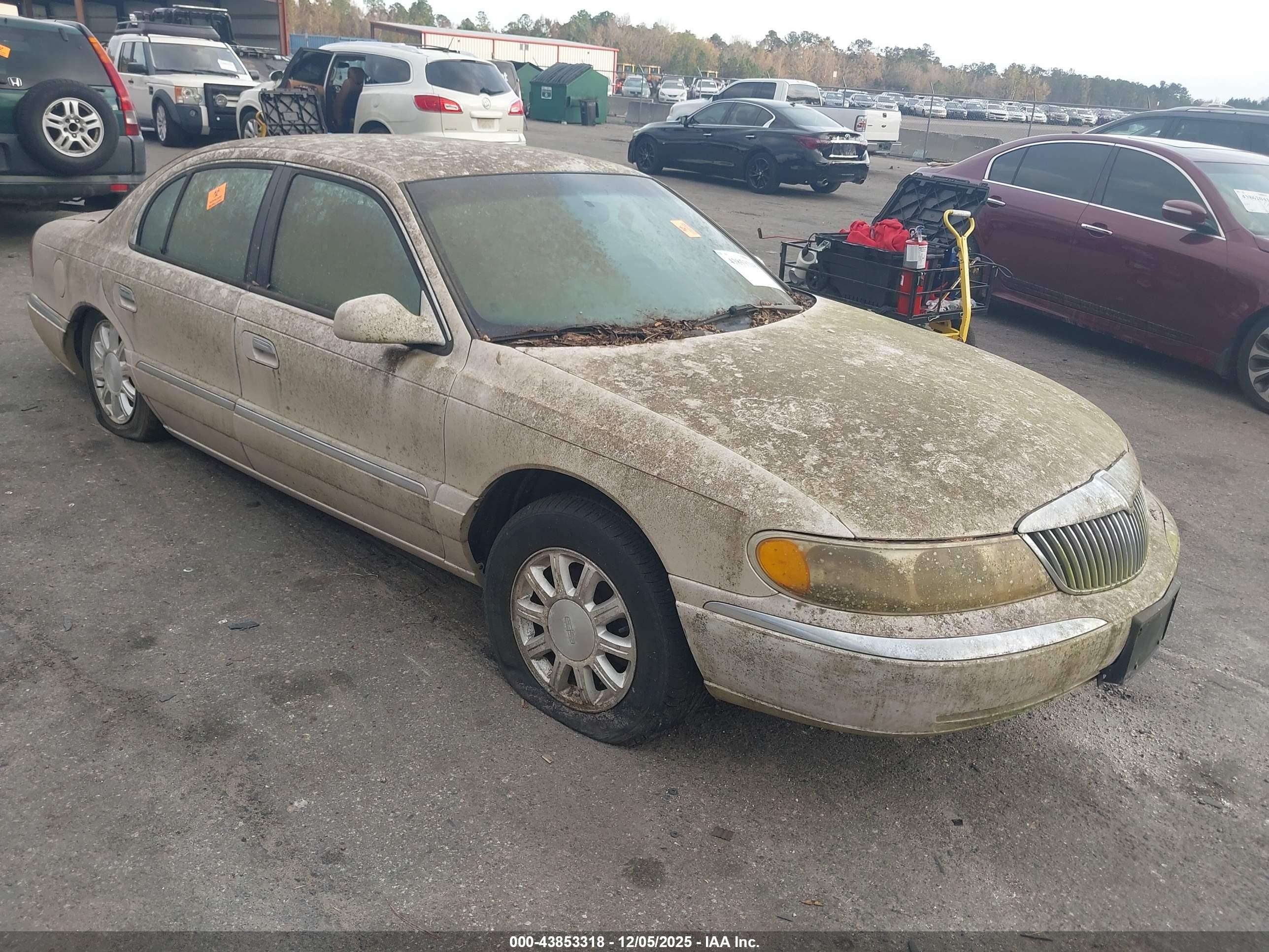 1999 Lincoln Continental   Champagne vin: 1LNHM97V1XY697540