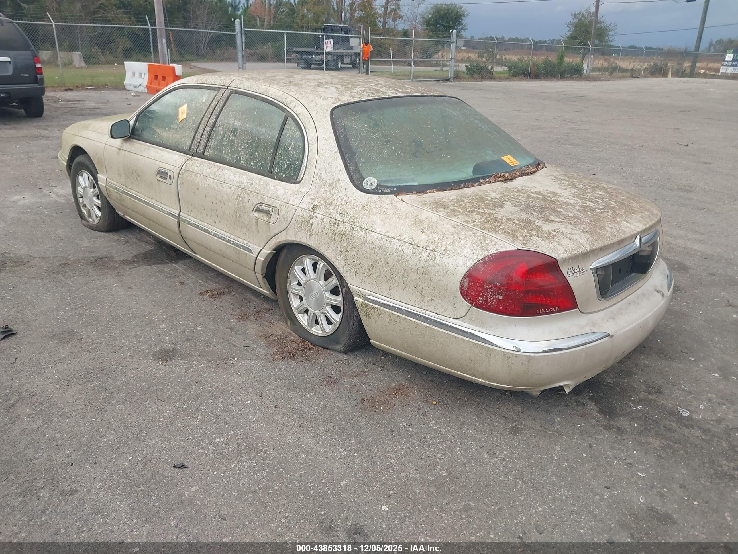 1999 Lincoln Continental   Champagne vin: 1LNHM97V1XY697540