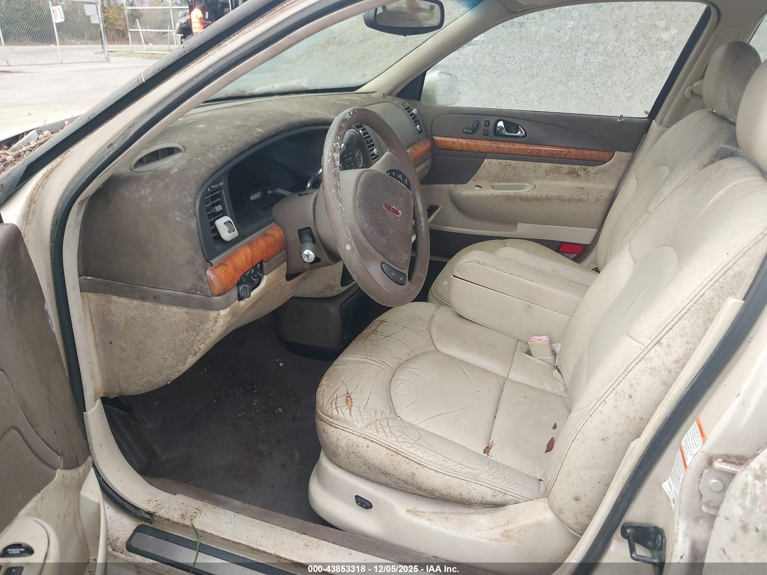 1999 Lincoln Continental   Champagne vin: 1LNHM97V1XY697540