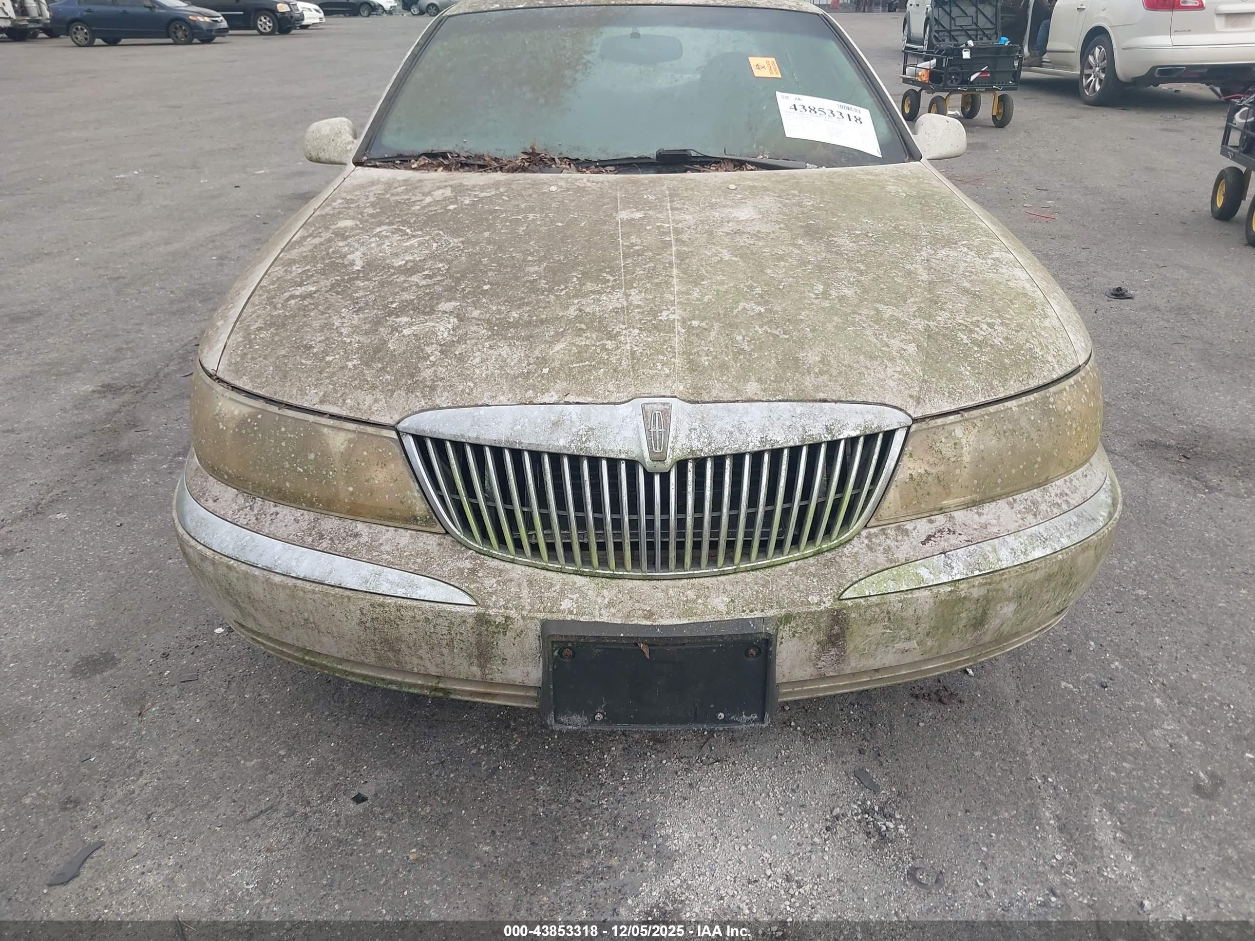 1999 Lincoln Continental   Champagne vin: 1LNHM97V1XY697540