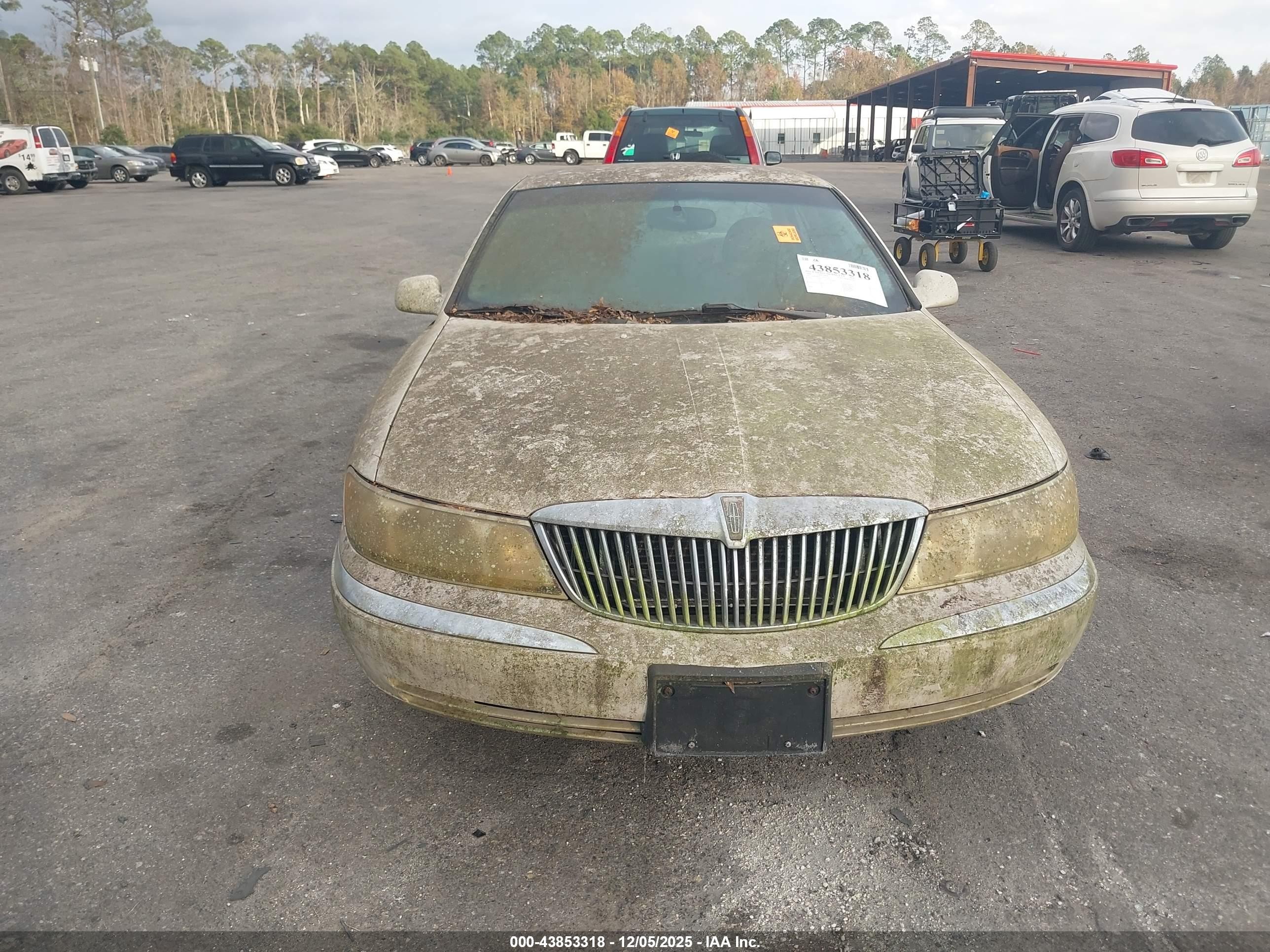 1999 Lincoln Continental   Champagne vin: 1LNHM97V1XY697540