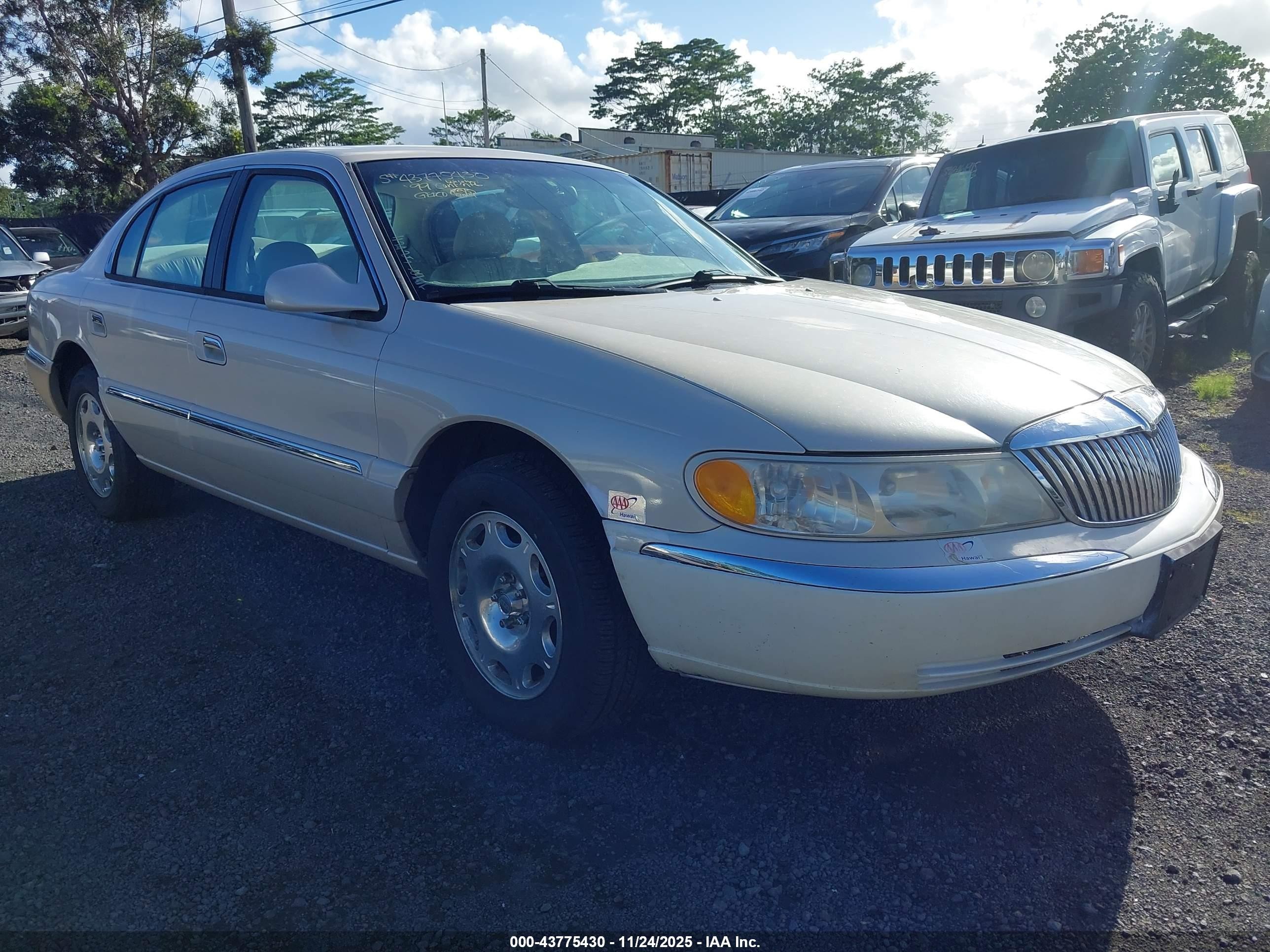1999 Lincoln Continental   Champagne vin: 1LNHM97V2XY693402