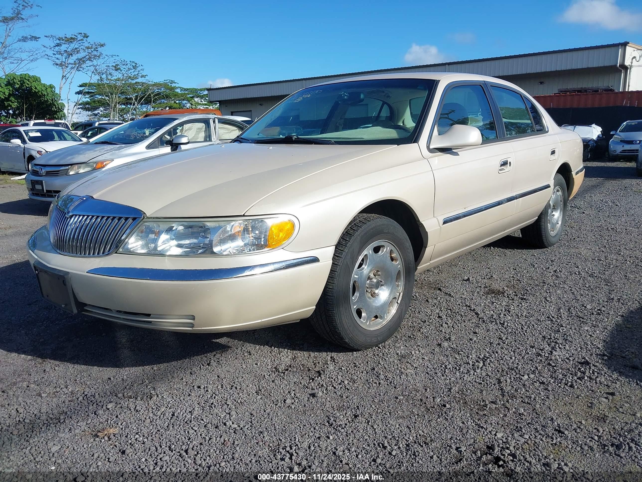 1999 Lincoln Continental   Champagne vin: 1LNHM97V2XY693402
