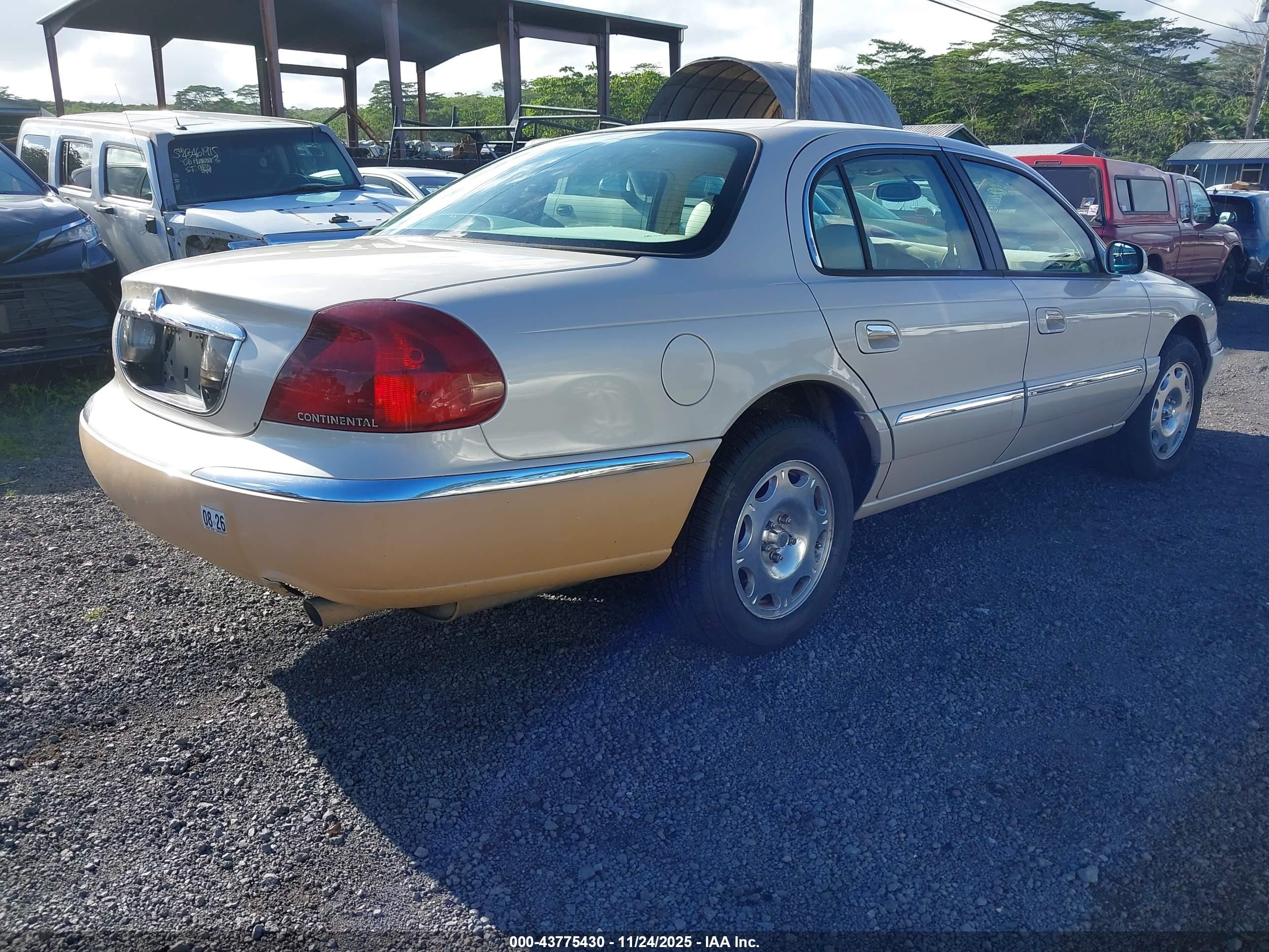 1999 Lincoln Continental   Champagne vin: 1LNHM97V2XY693402