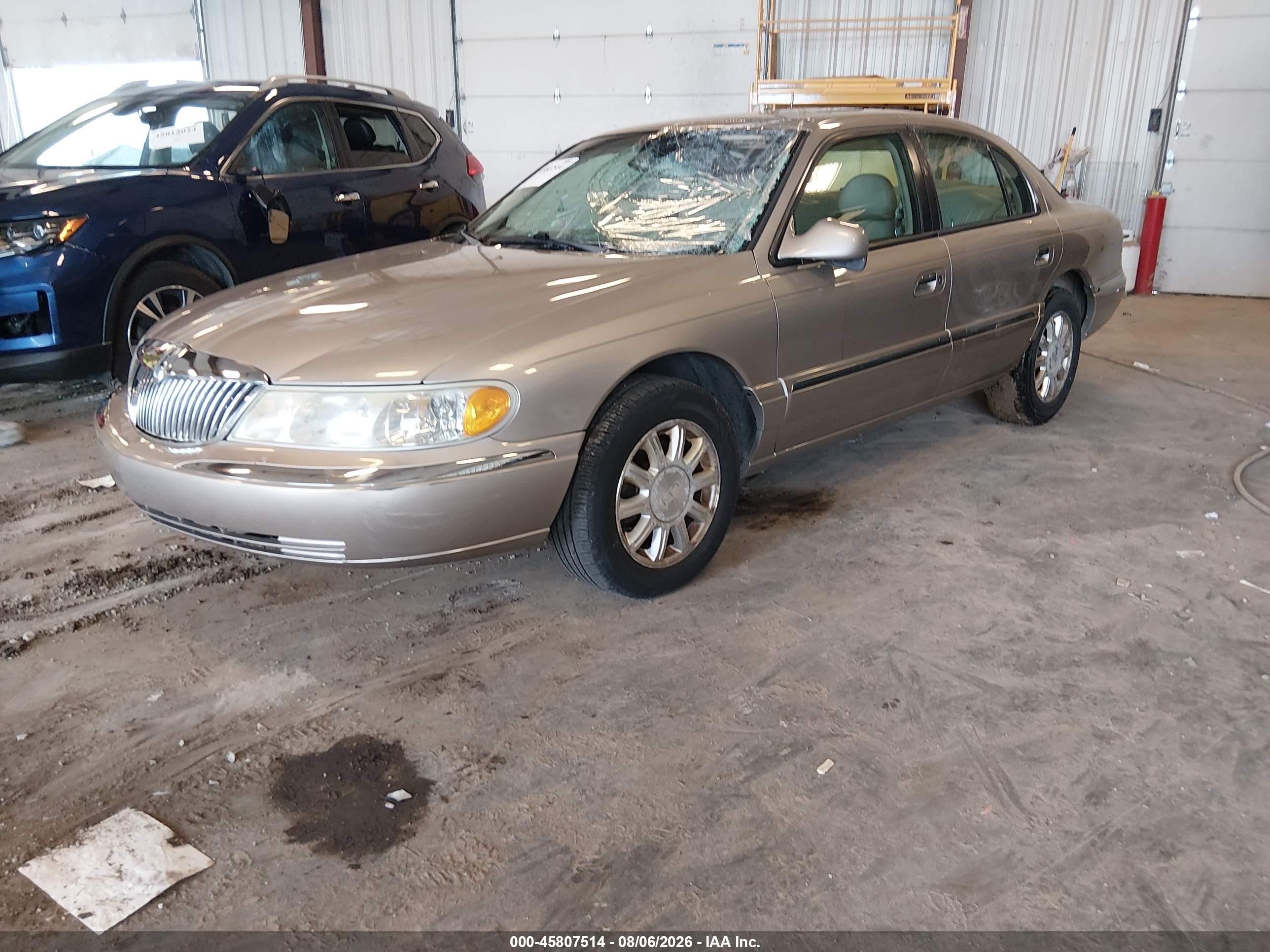 2002 Lincoln Continental   Tan vin: 1LNHM97V32Y695992