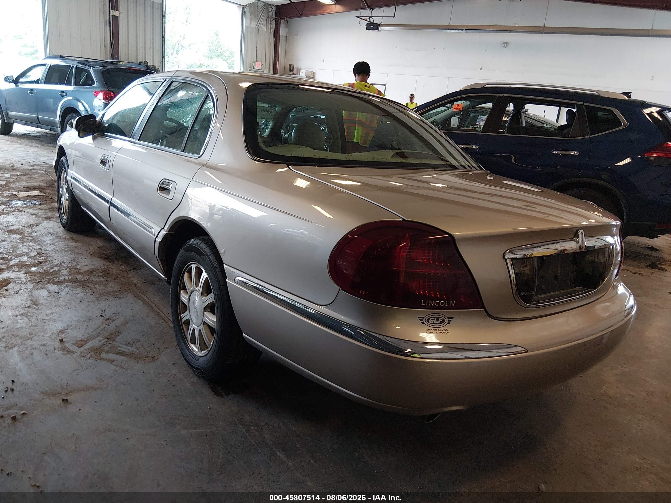 2002 Lincoln Continental   Tan vin: 1LNHM97V32Y695992