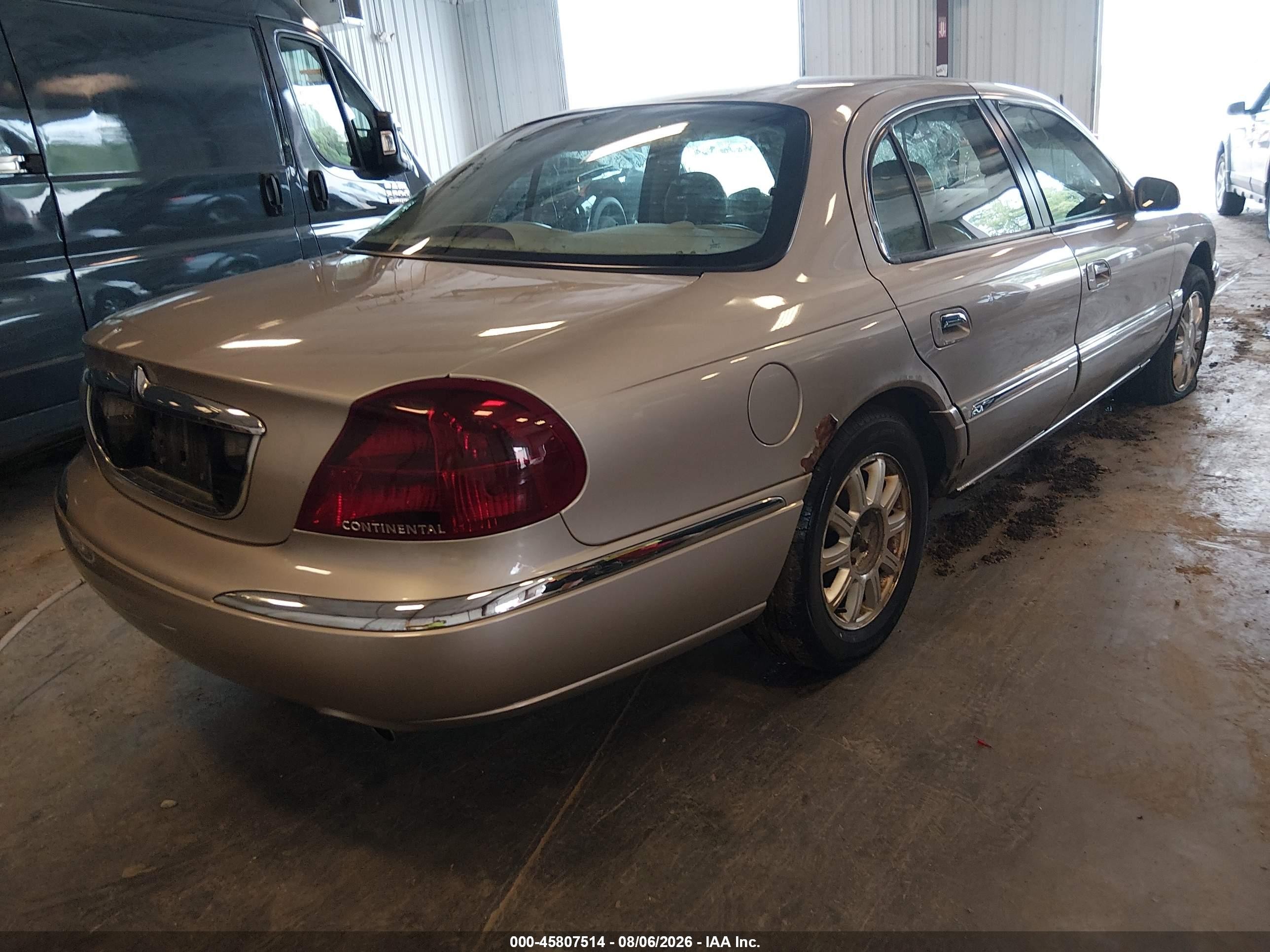 2002 Lincoln Continental   Tan vin: 1LNHM97V32Y695992